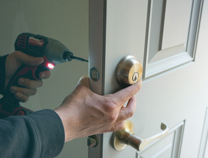 Keywe locksmith installing a deadbolt