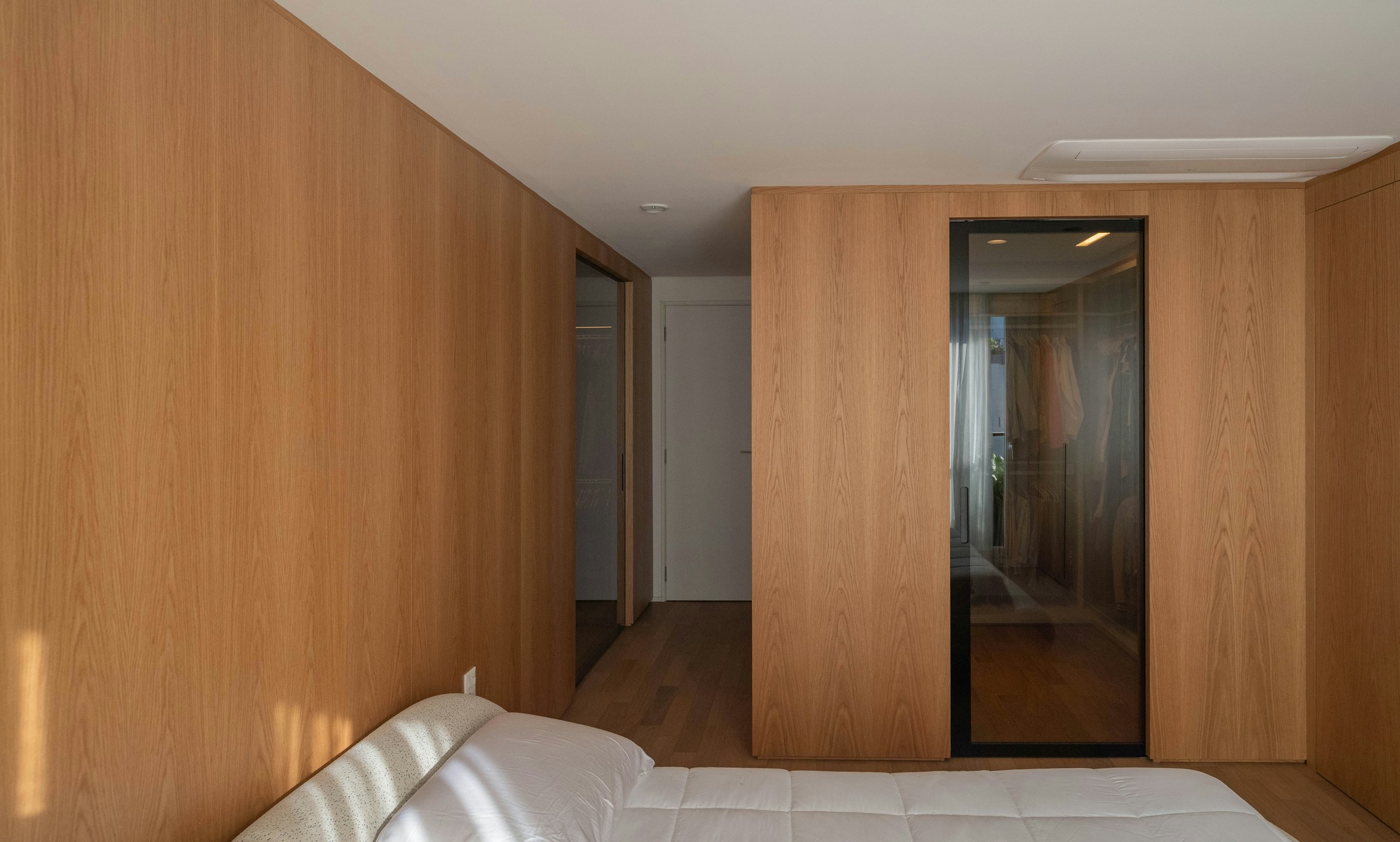 Modern wood-paneled bedroom