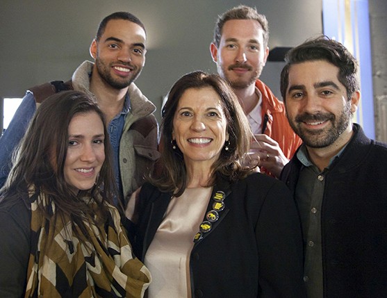 group photo of three men and two women
