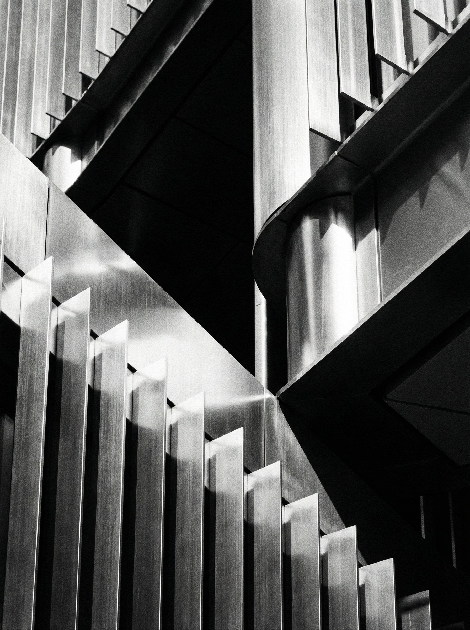 grayscale photo of people walking towards building