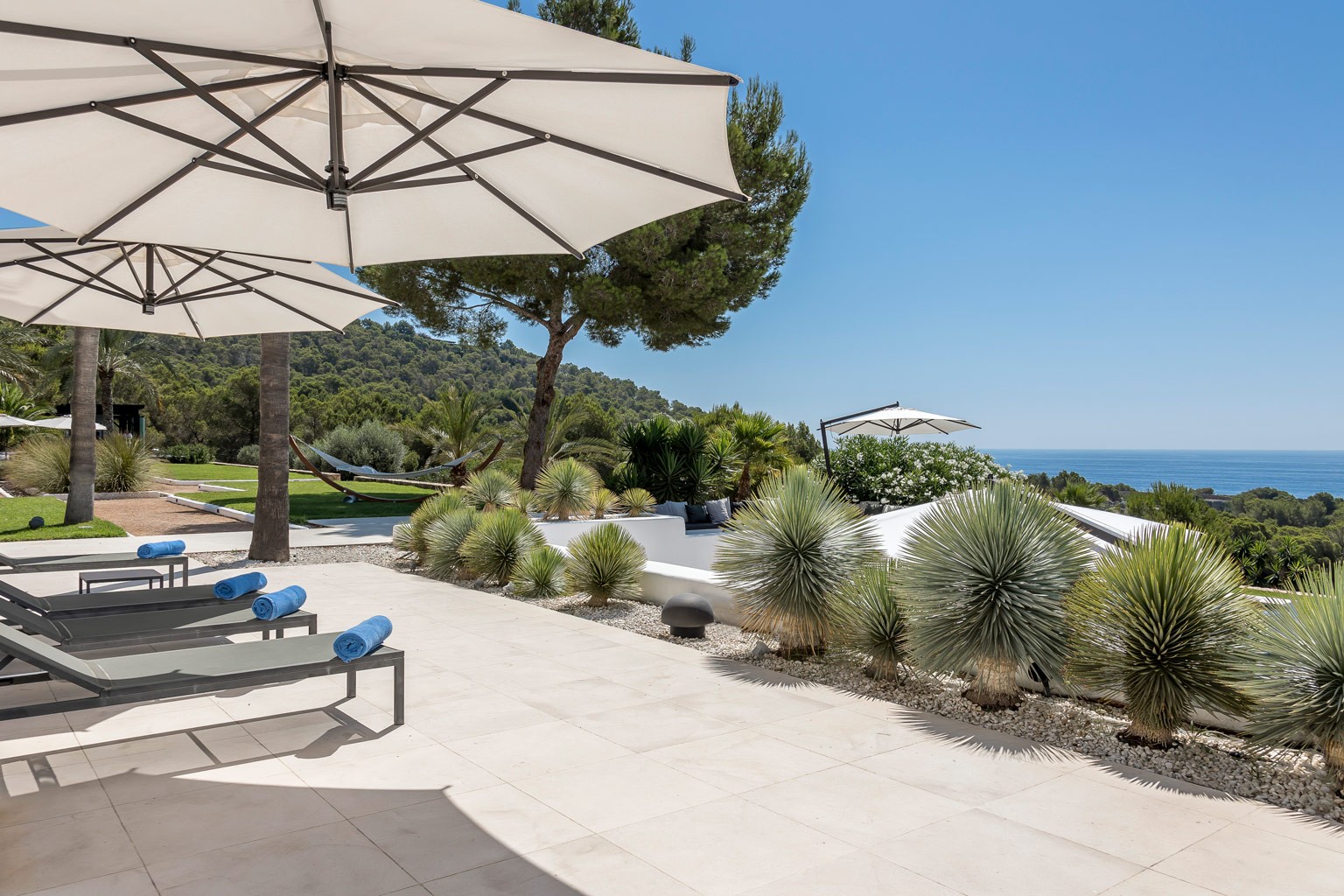 Sunbeds on the terrace of the exclusive luxury villa in Ibiza—privacy-focused VIP estate property holiday retreat for weddings and events.