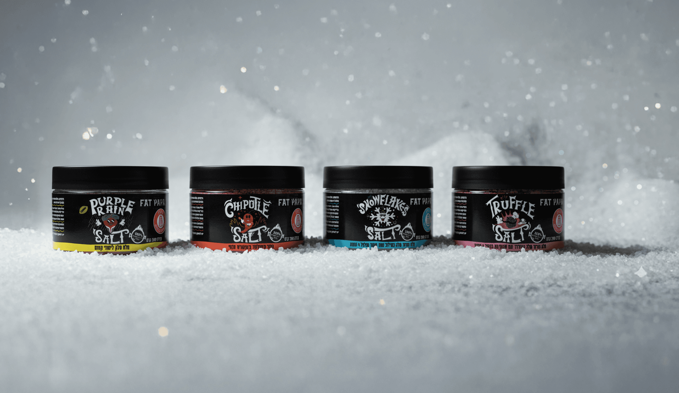 Fat Papa spice jars displayed outdoors in a snowy environment.