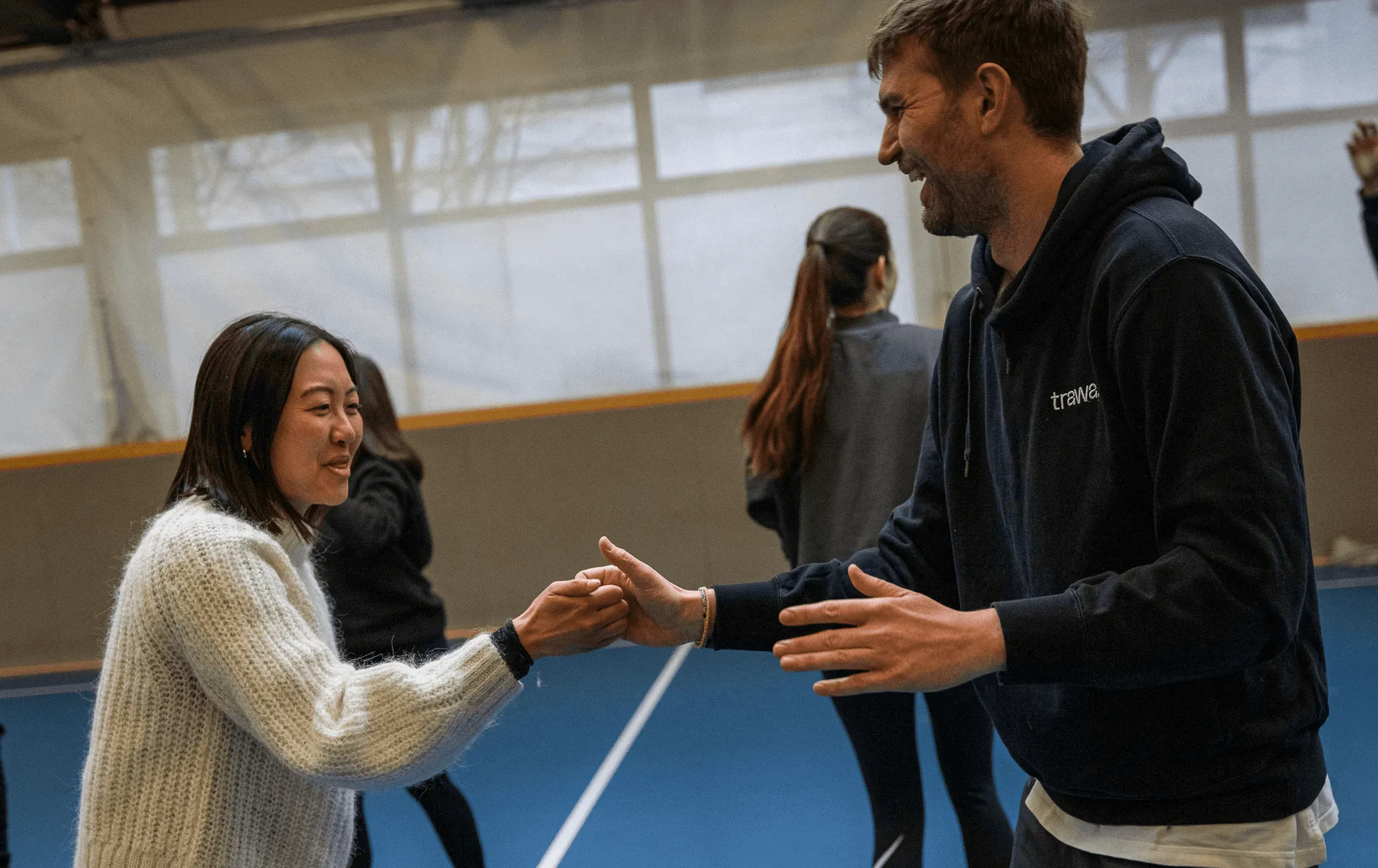 A crowd people dancing in a room