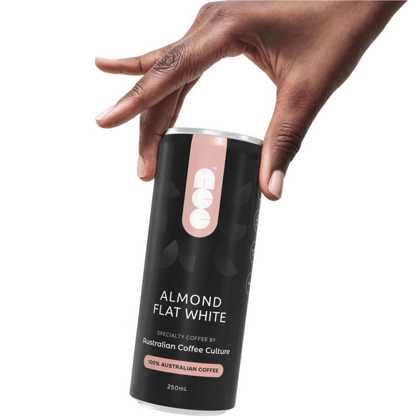 Hand holding a 250ml Almond Flat White can made with 100% Australian-grown coffee beans.