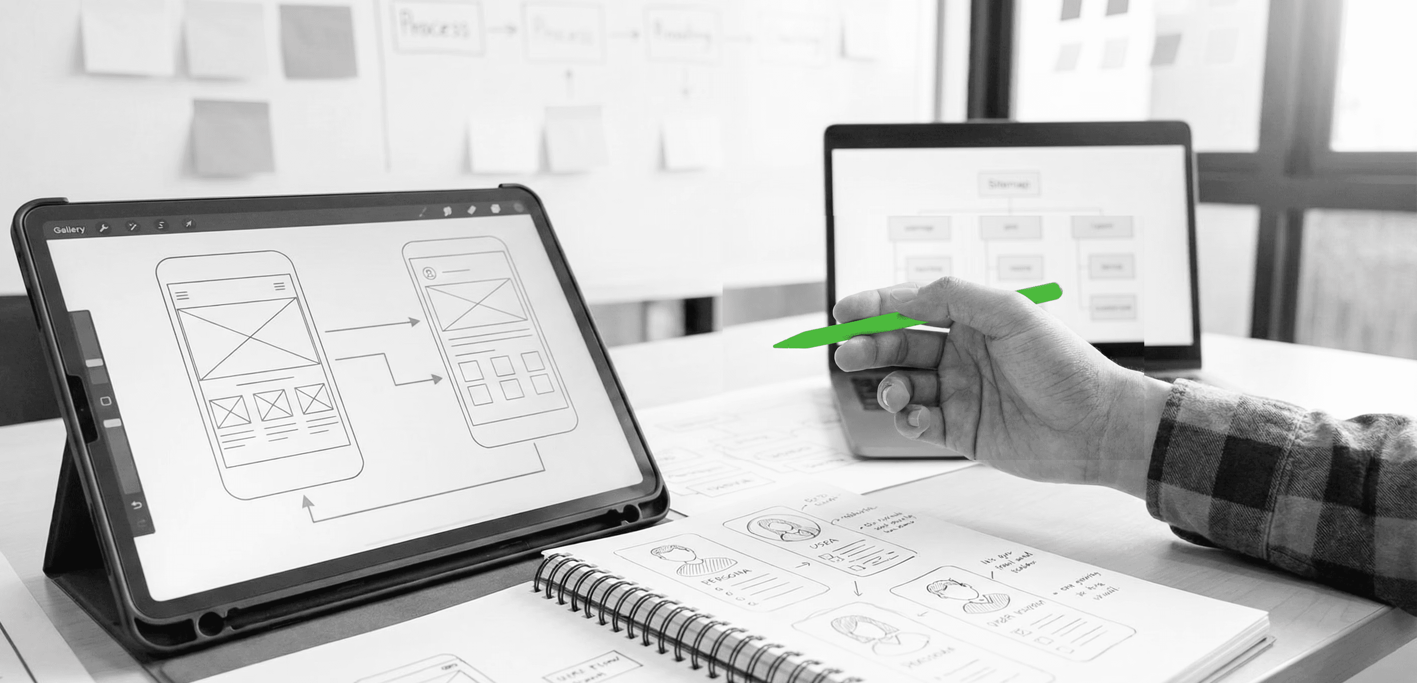 A fast black sports car races down the highway.