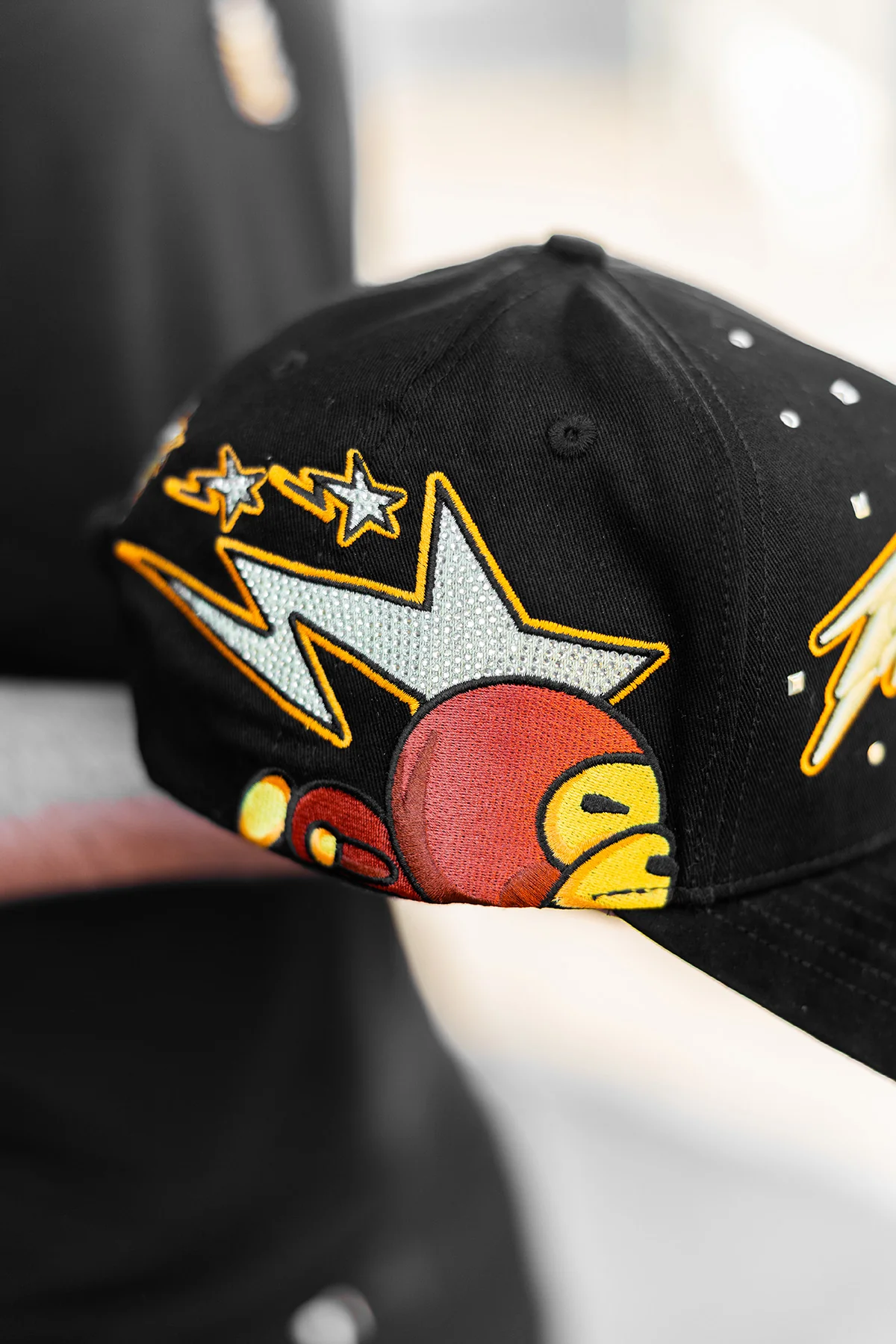 a woman sitting at a table using a laptop computer