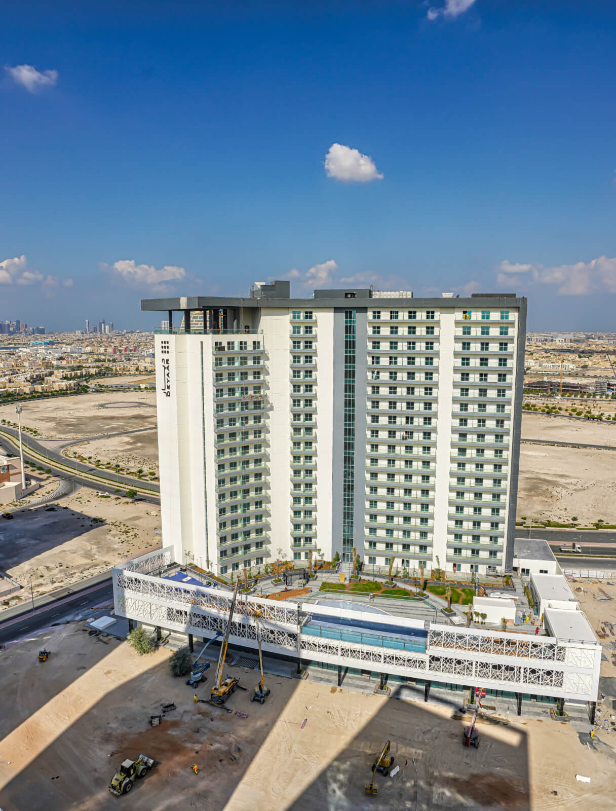 Aerial view of Bella Rose building architecture. Trust our agents for expert guidance in Dubai real estate.