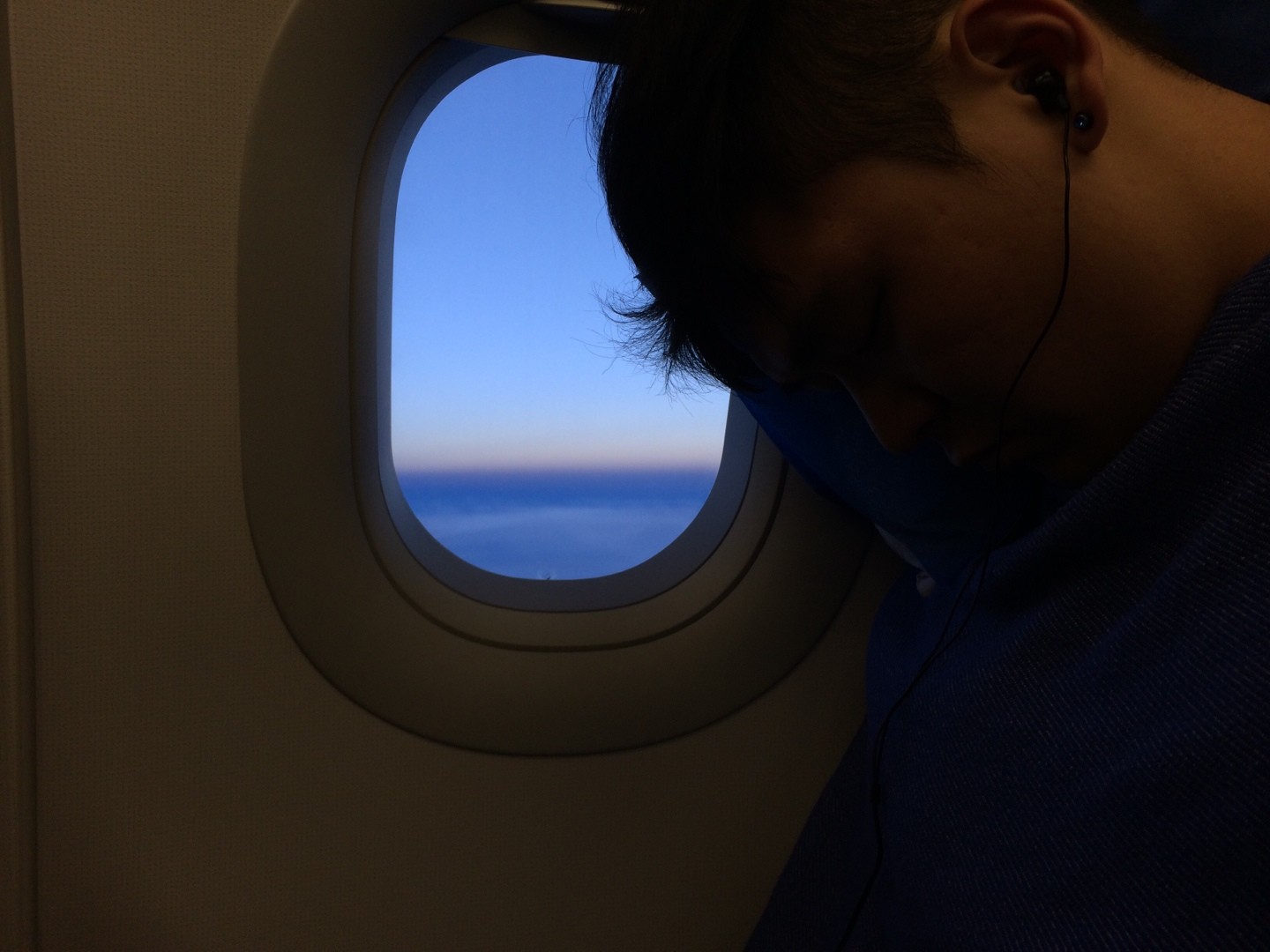 headshot of male in dark background