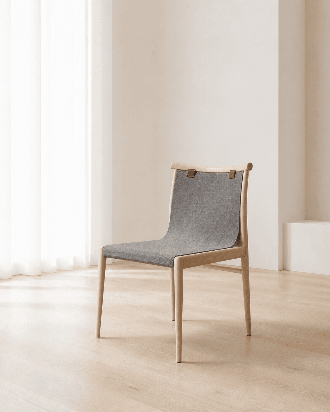 Ledger Dining Chair placed in a luminous, minimal white interior