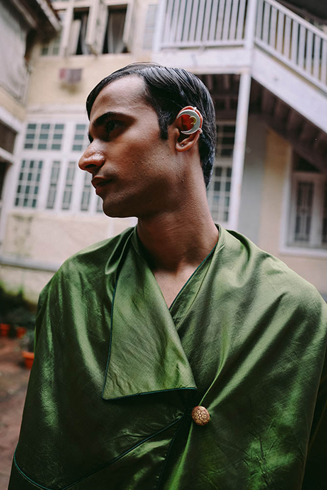 Patang zero-waste folded top with fabric button paired with Paunji dhoti pants featuring structured hem and ankle buttons