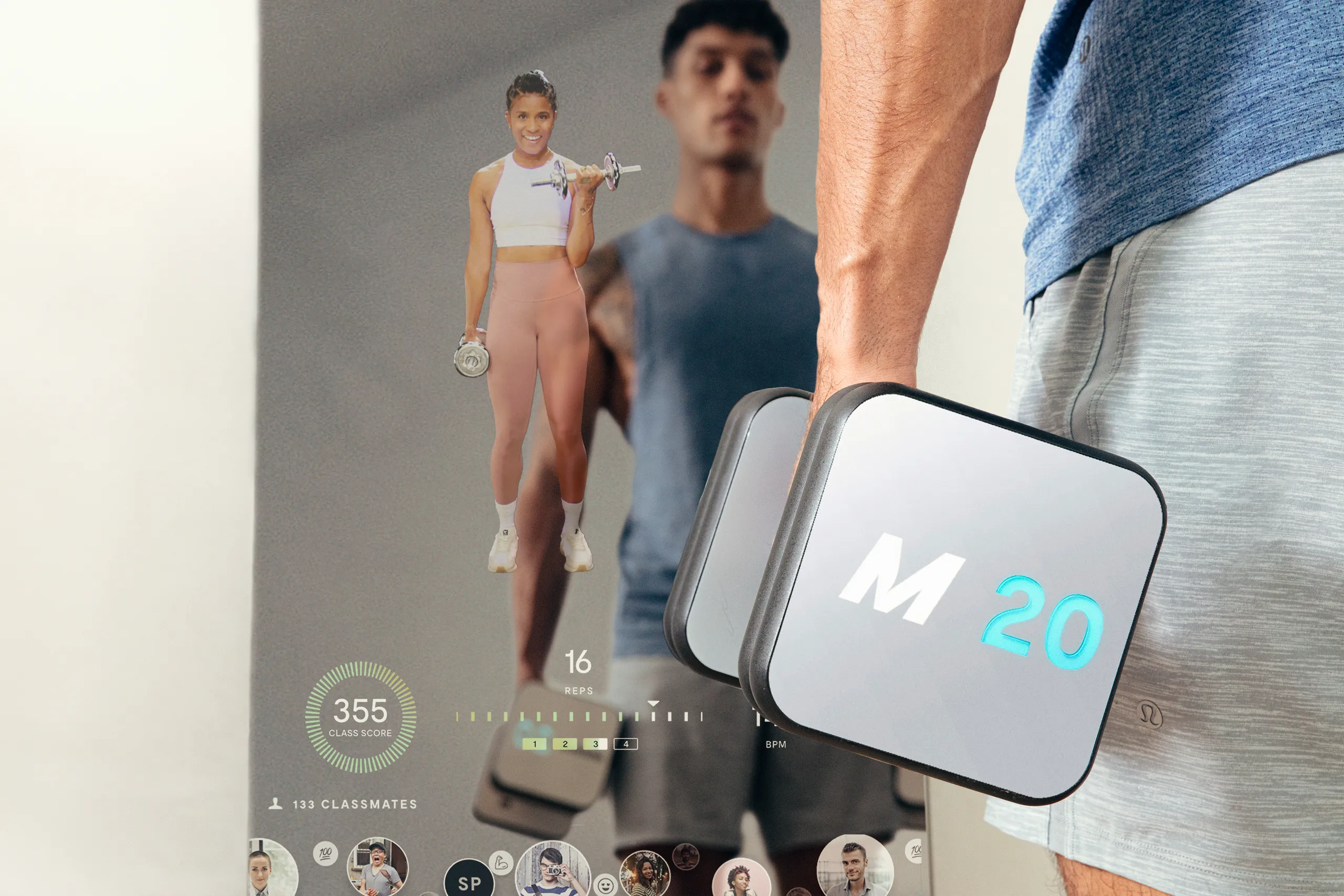 Person holding an M20 Mirror smart dumbbell beside the connected fitness mirror interface