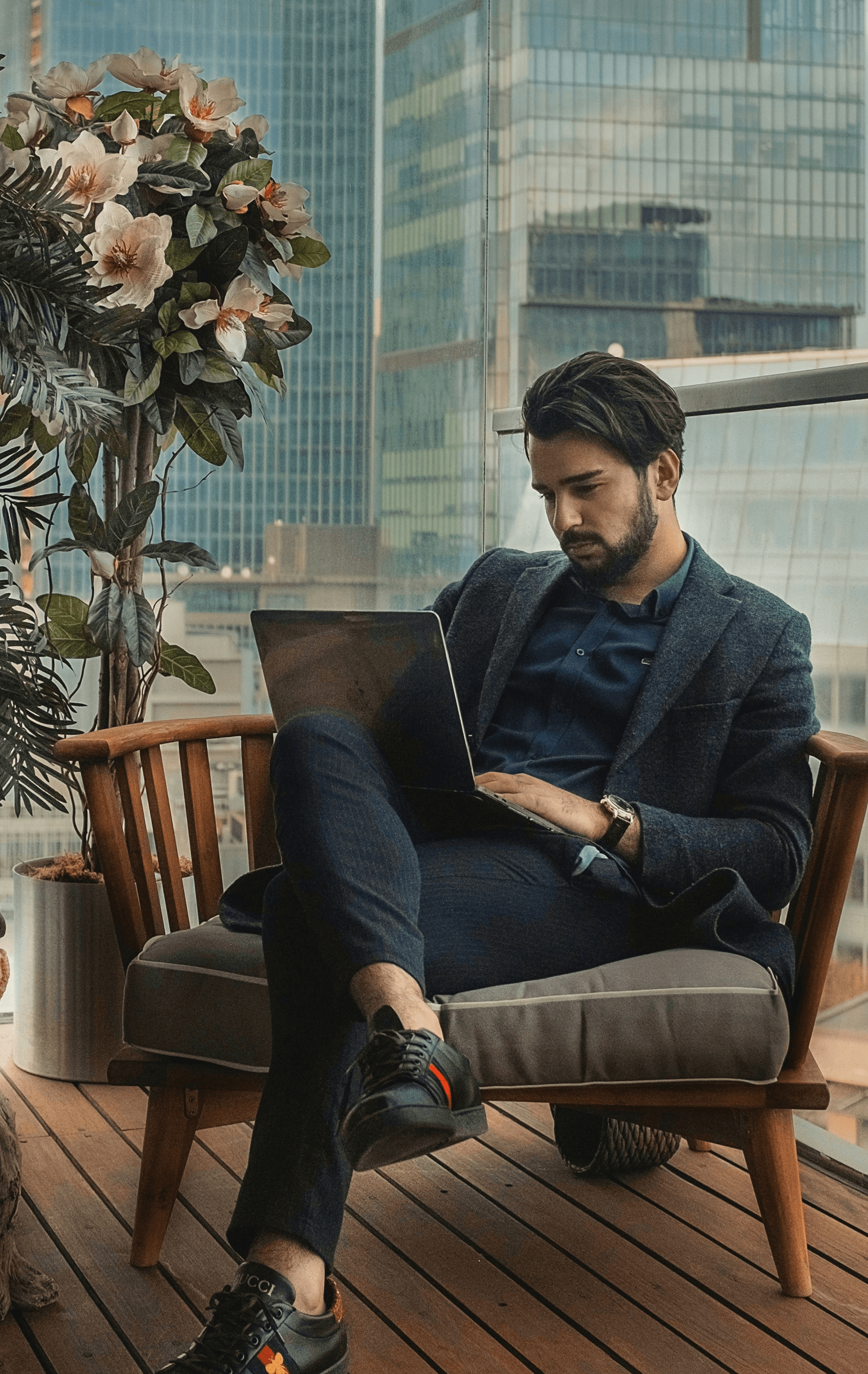 man sitting beside side table