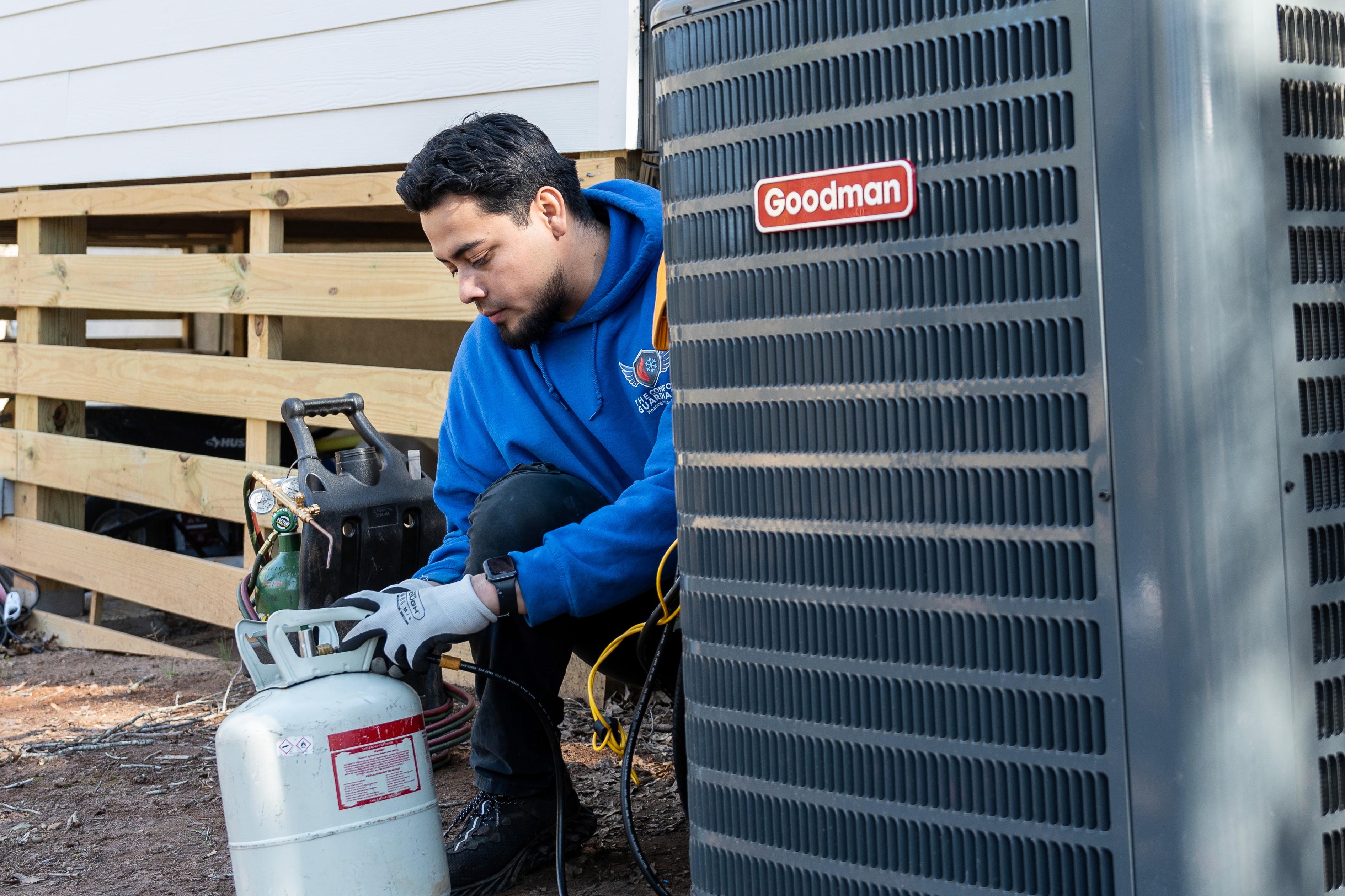 man in blue denim jacket carrying girl in white sweater during daytime