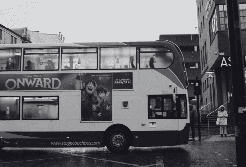 black flat screen tv turned on in a dark room