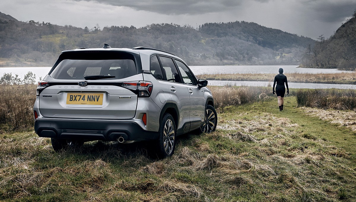 Large 96 sheet billboard above a road that has rain drops on it and reads Welcome to Manchester decent wipers are a must