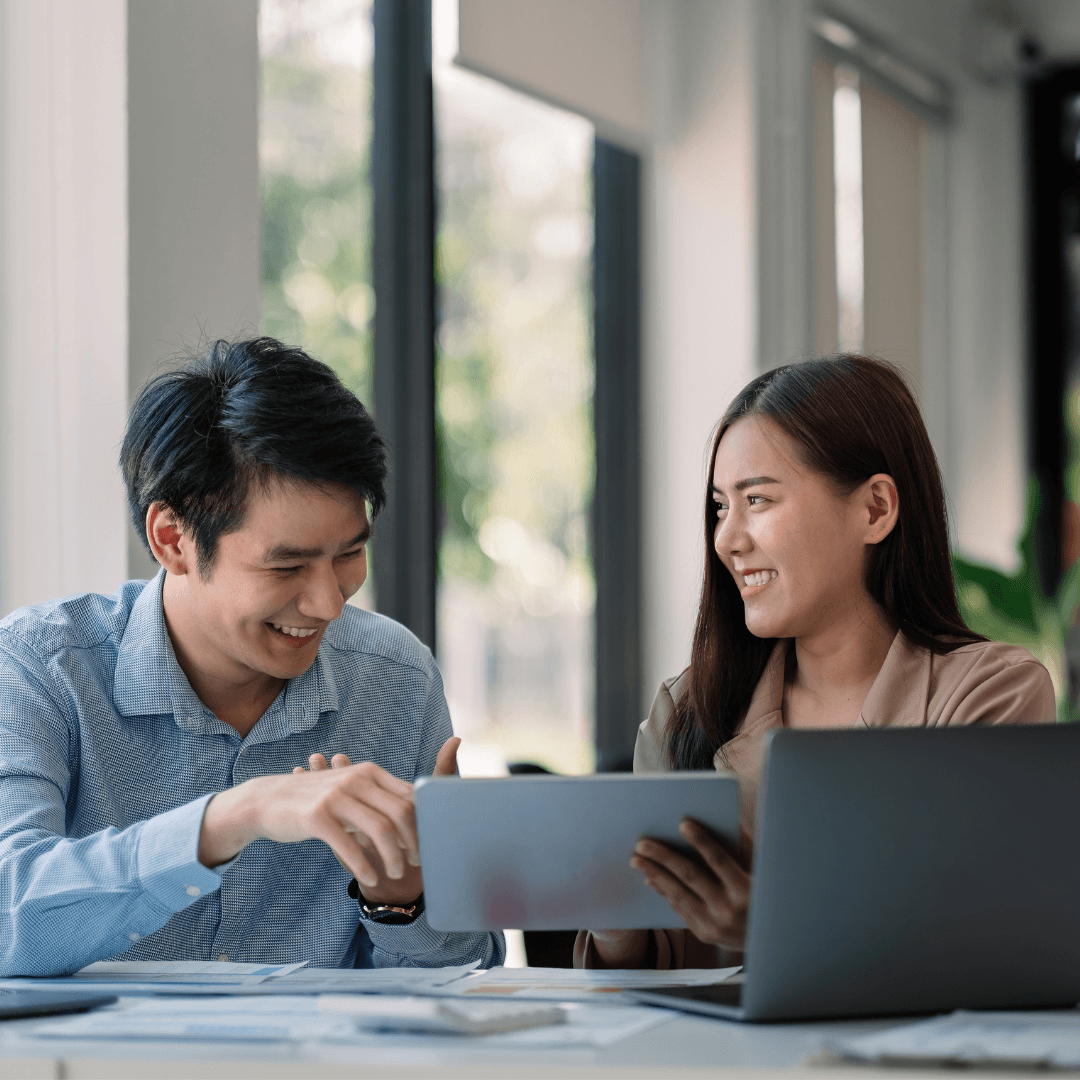 Two professionals reviewing AI-powered business tools