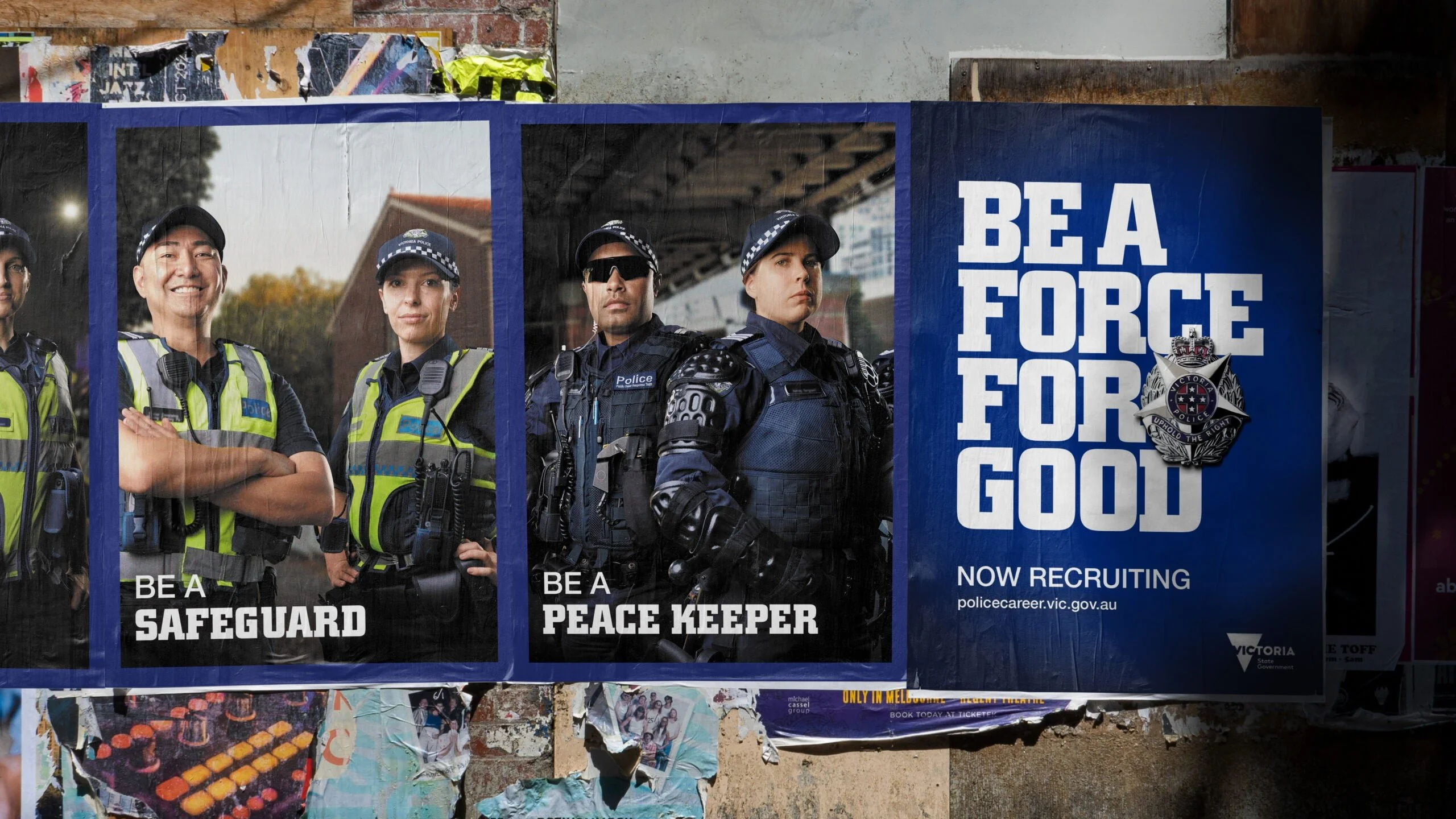Wall of Victoria Police posters: 'Be a safeguard', 'Be a peace keeper' and 'Be a force for good. Now recruiting'