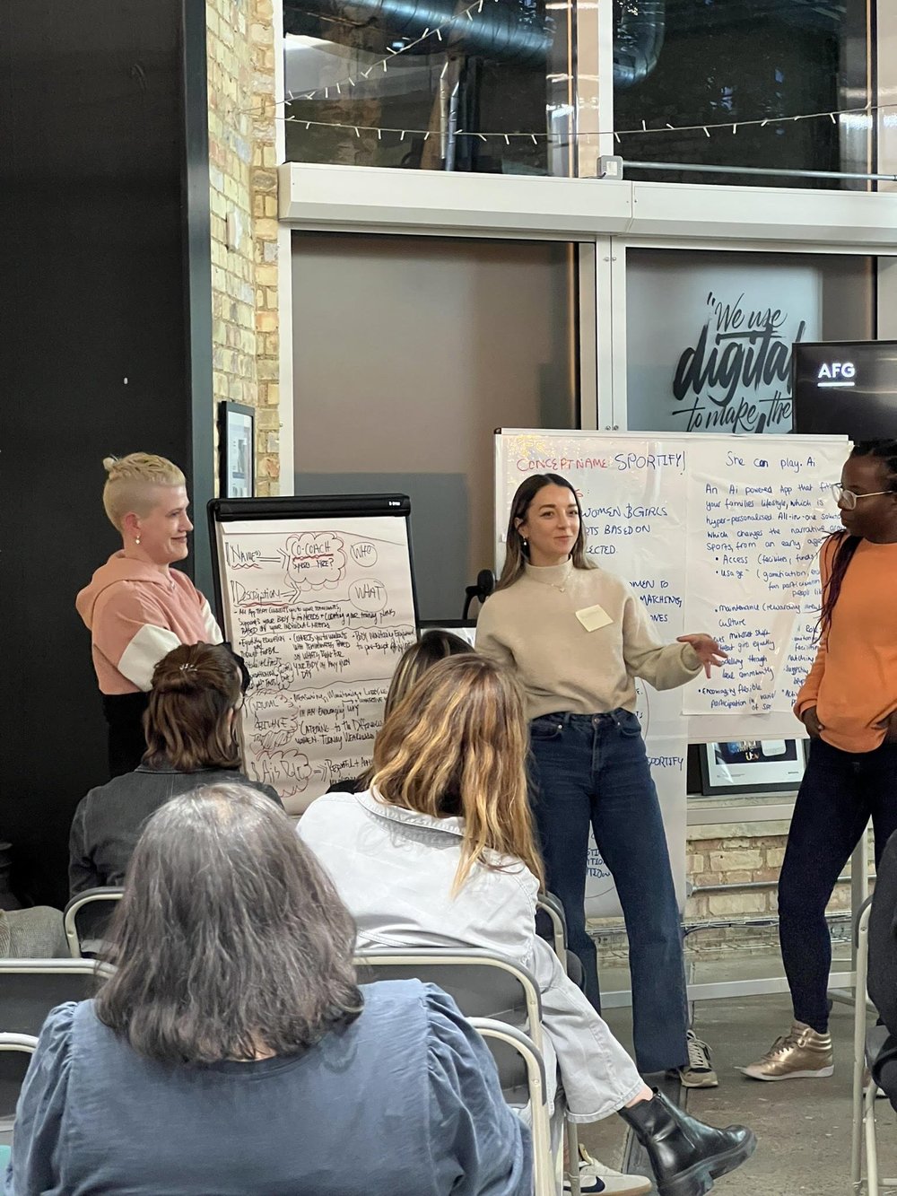 Presenter pitching ideas in front of a crowd