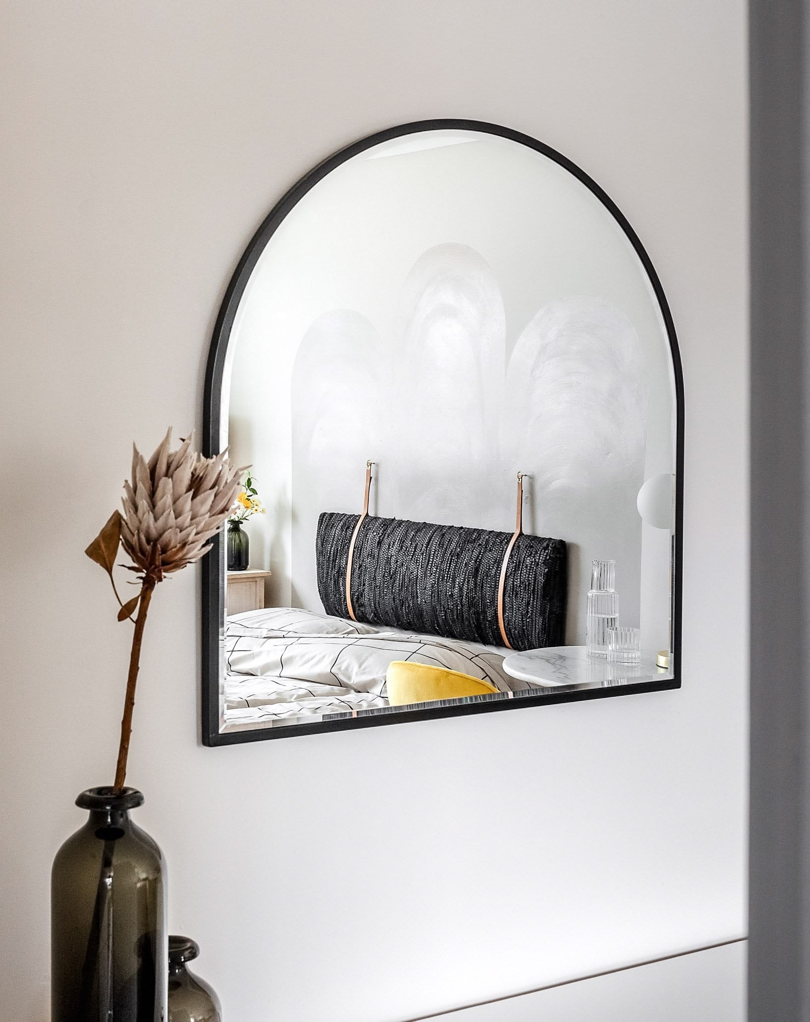 Bedroom with strategically placed mirror reflecting natural light and views, enhancing brightness and space, Atelier Akuko