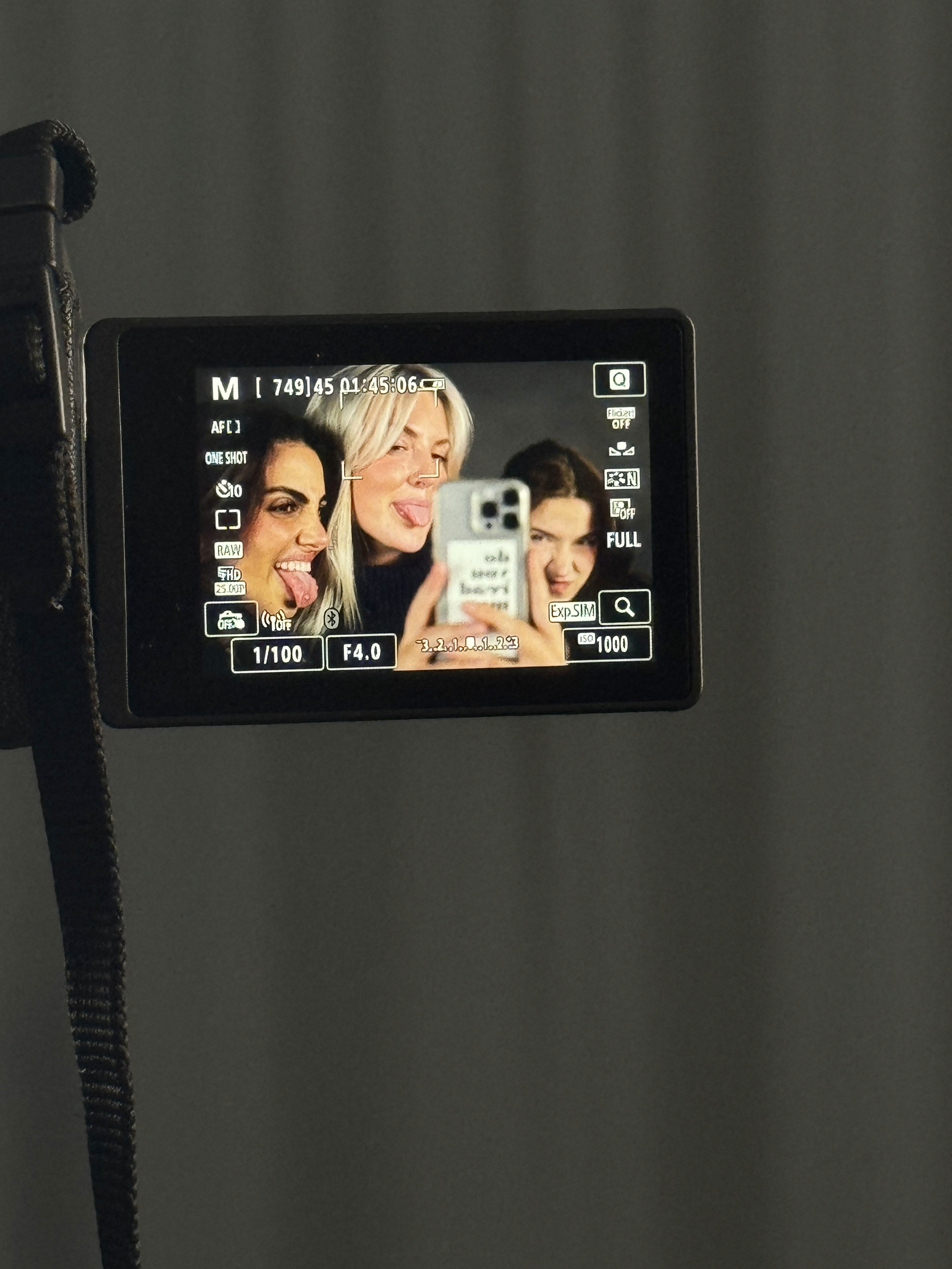 Person sitting on a ledge overlooking New York City skyline