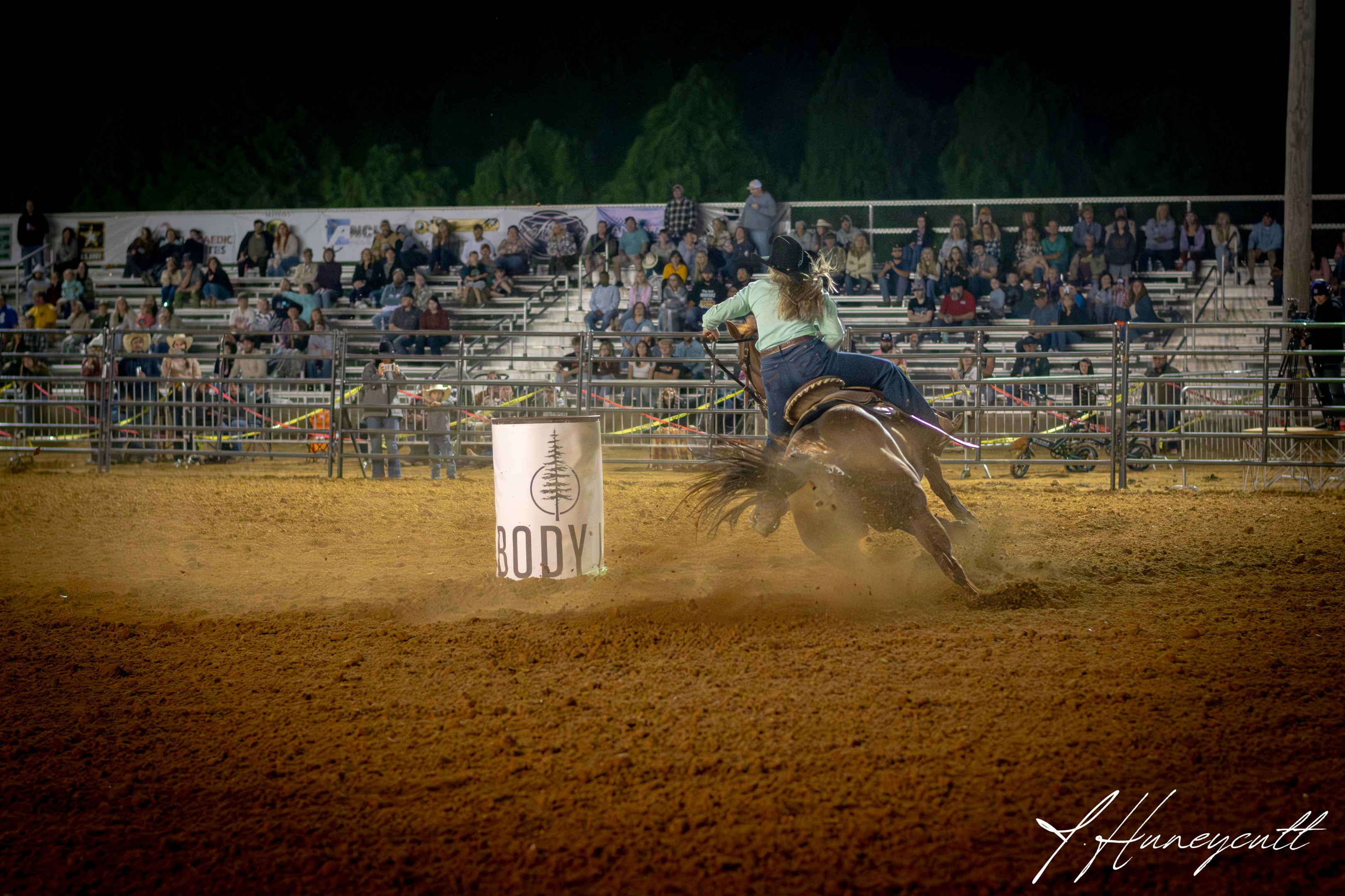 Cowgirl barrel racing at River City Rodeo