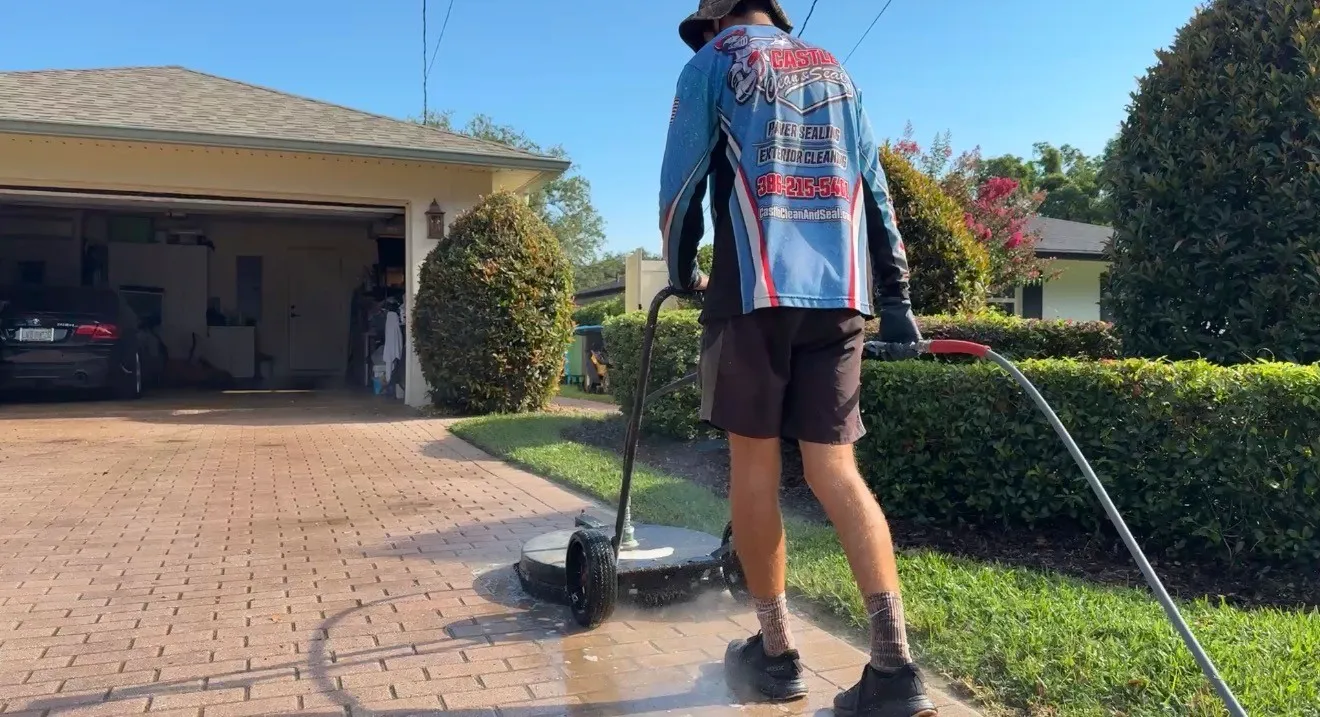 Technician cleaning pavers