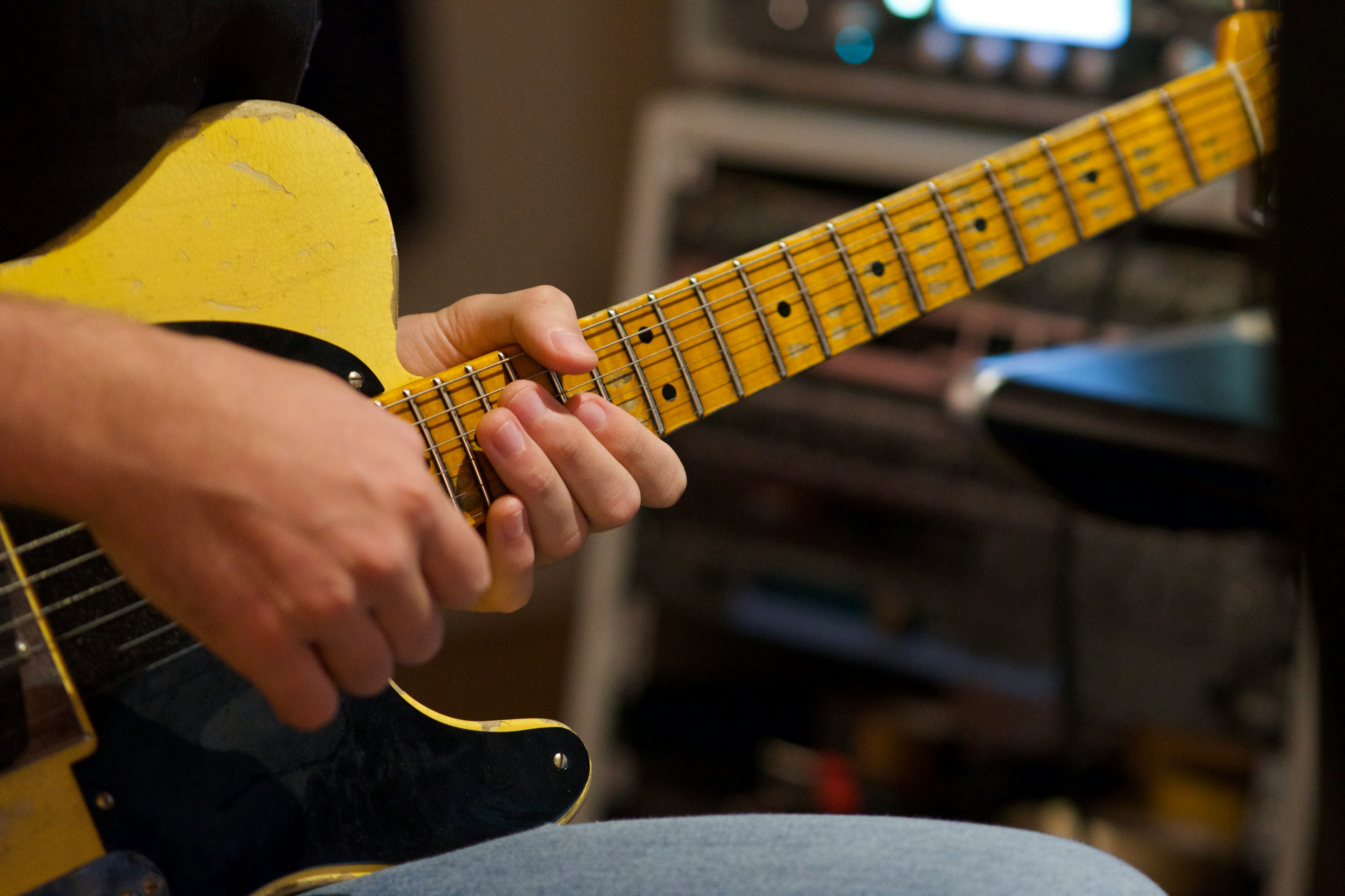 Person Playing Guitar - How To Get Into Music Production