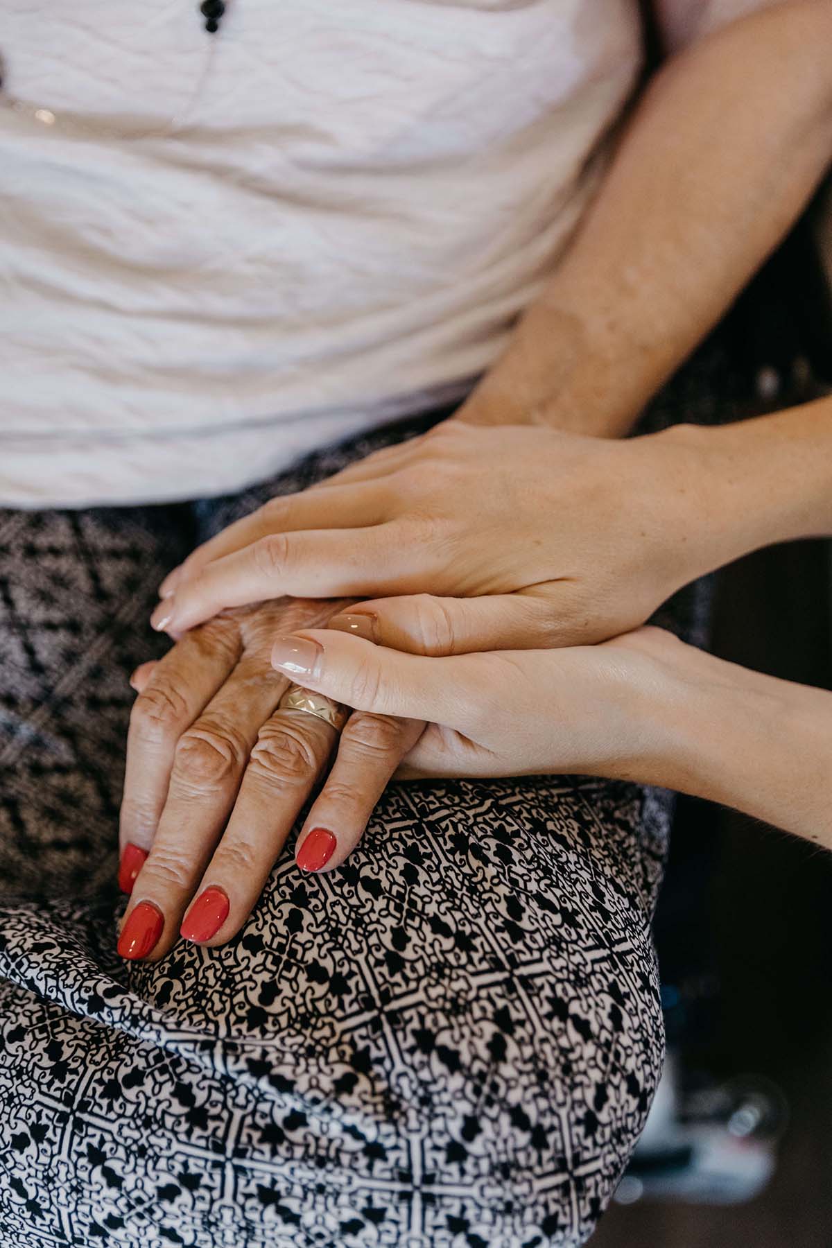 Close up shot of comforting hands.