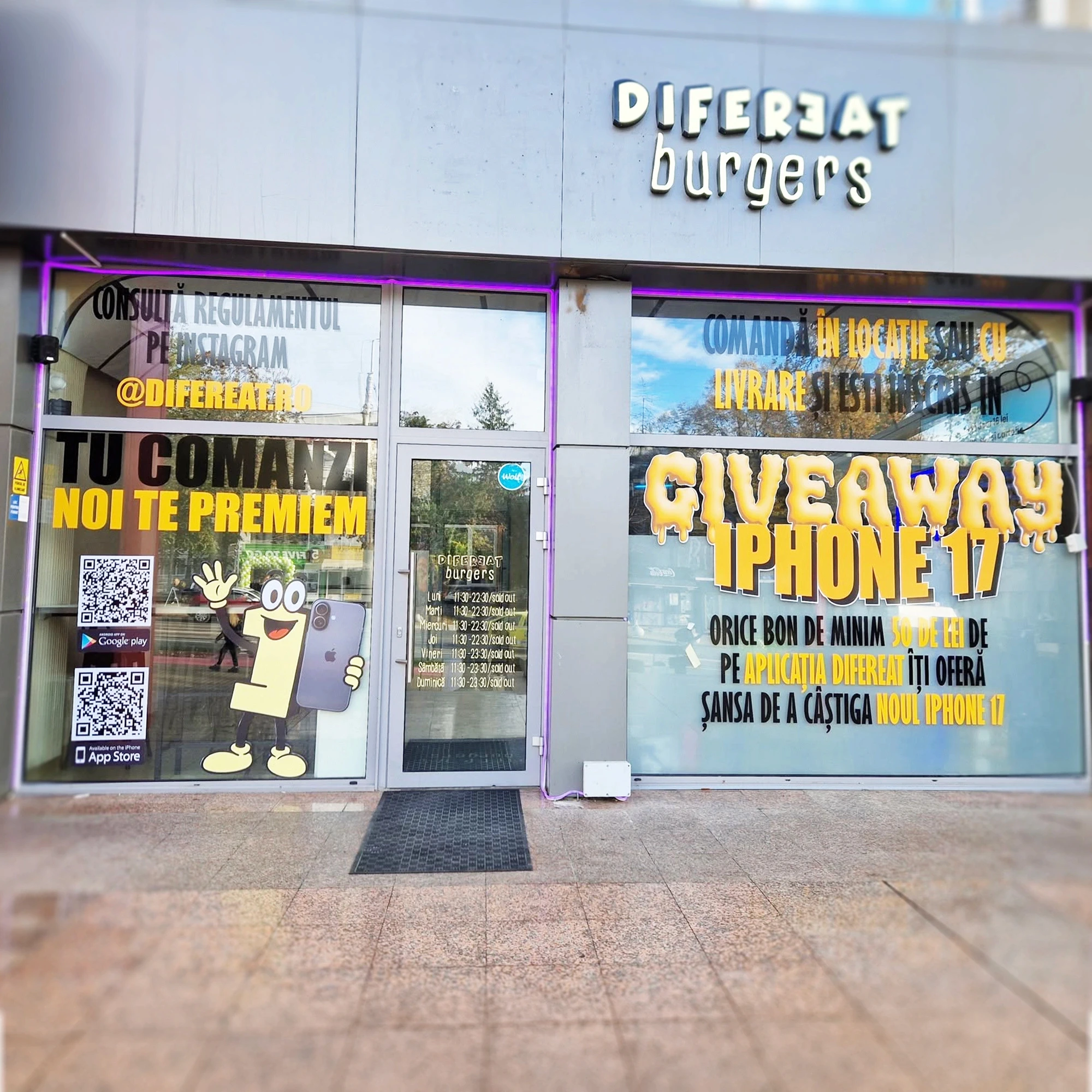 Vitrina Difereat Burgers colantată cu print publicitar pentru giveaway iPhone 17