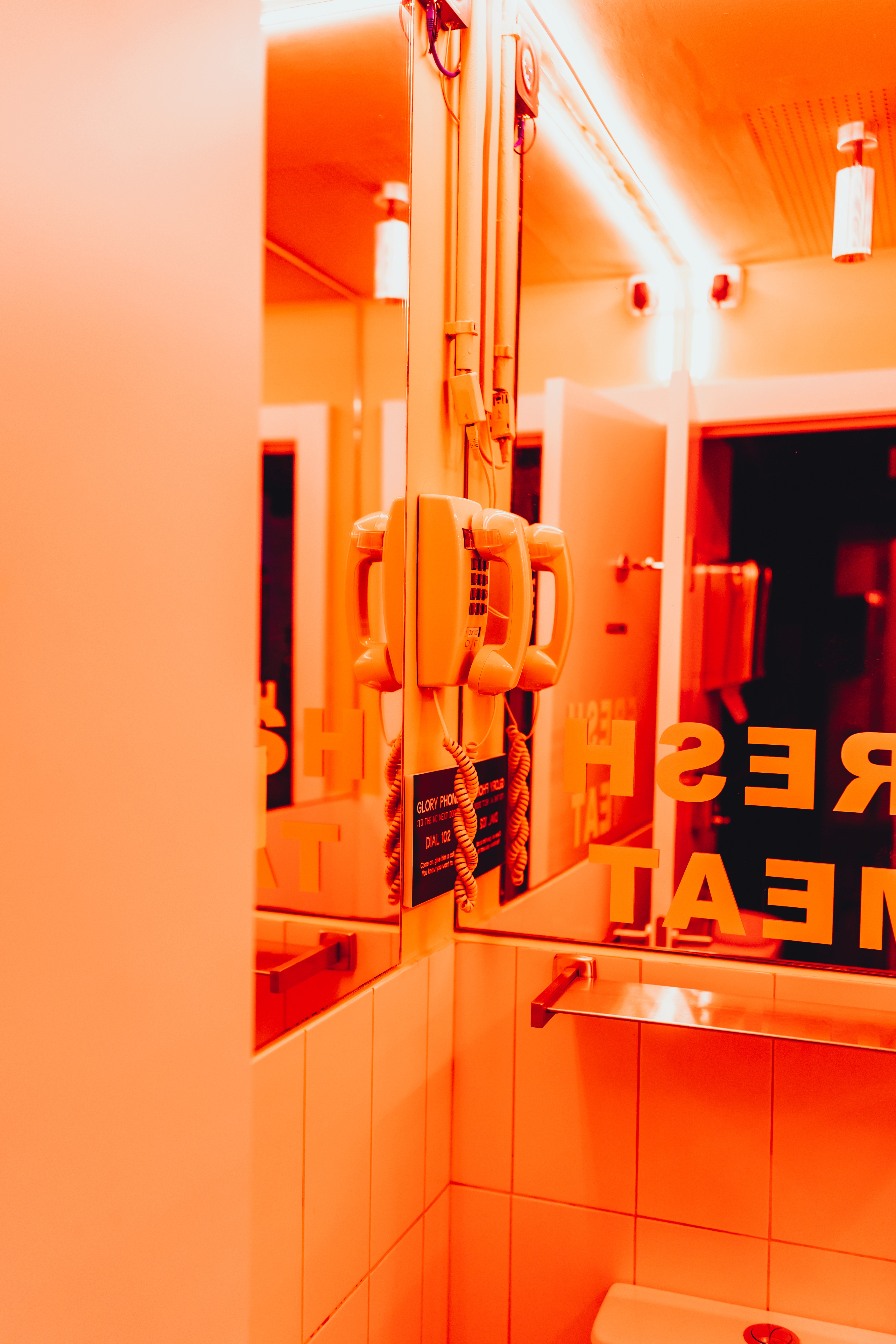 Streetside billboard with flyposters of the Batch.Works brand and illustrations