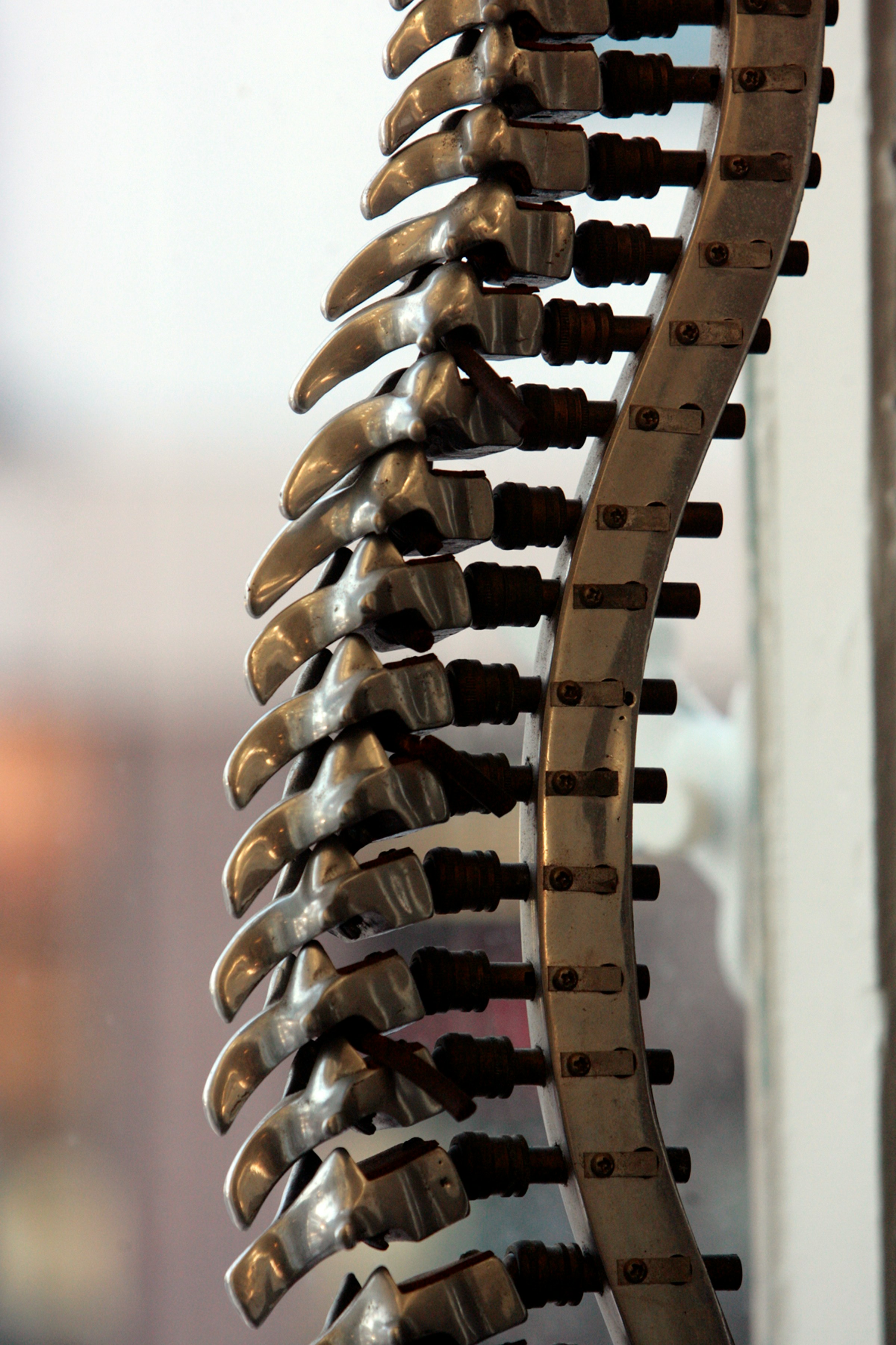 a bunch of metal objects hanging from a wall