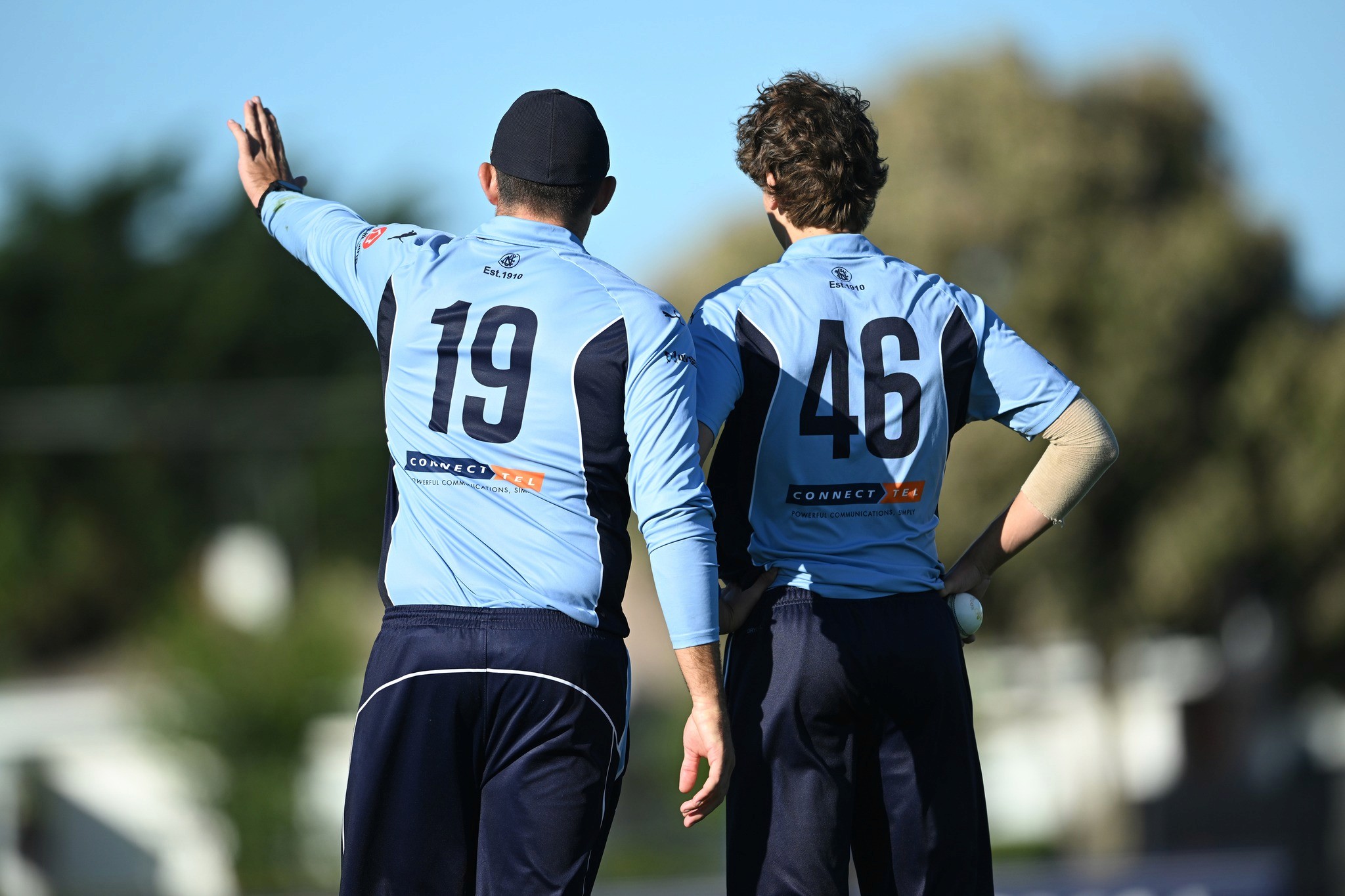 Captain and bowler Image