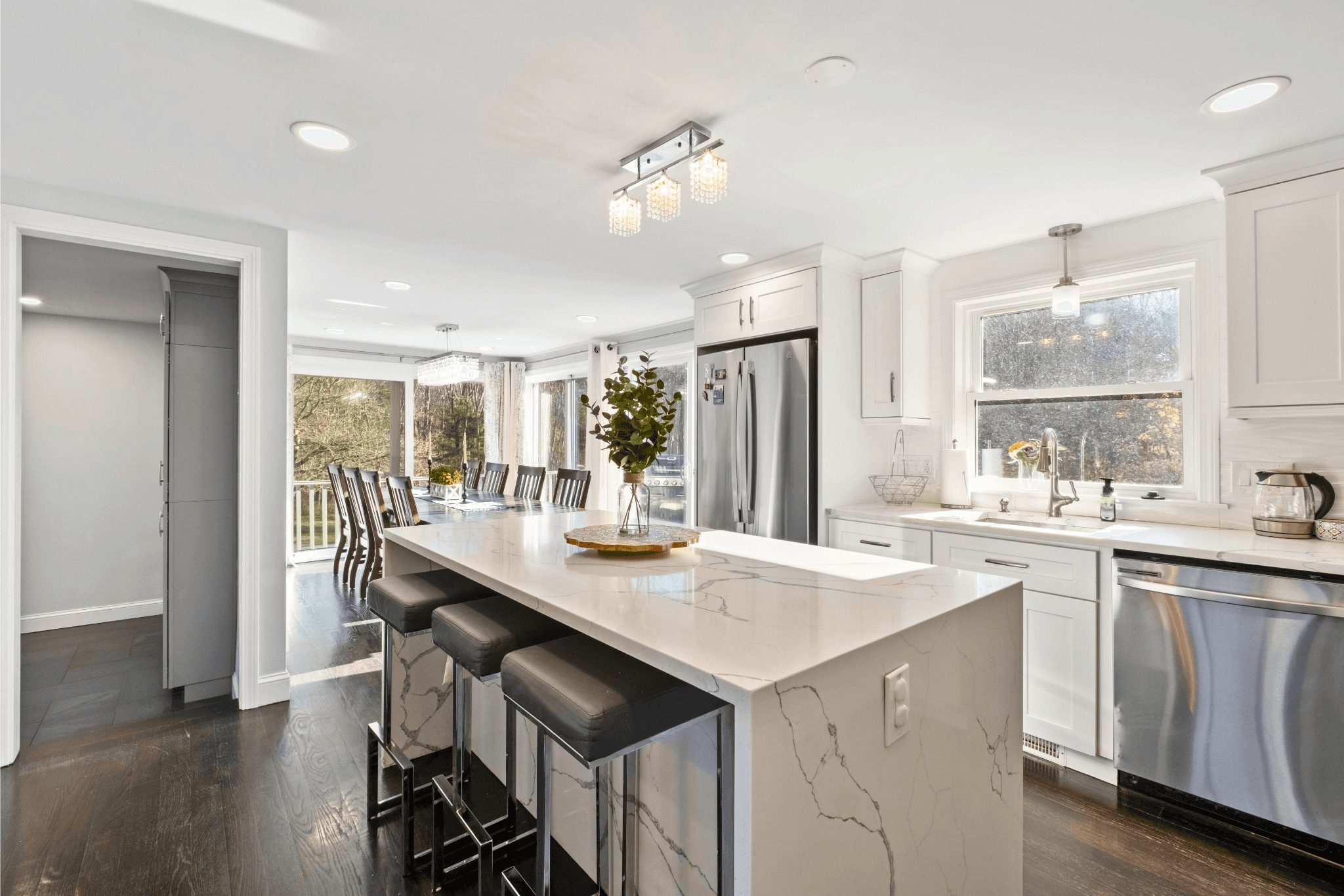 Bright, modern kitchen in Northborough’s Sakura House vacation rental, featuring a large marble island, stainless steel appliances, and natural light—perfect for extended Airbnb stays in Massachusetts.