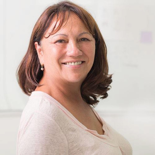 A portrait photo of Rhonda Kite, smiling and facing the camera