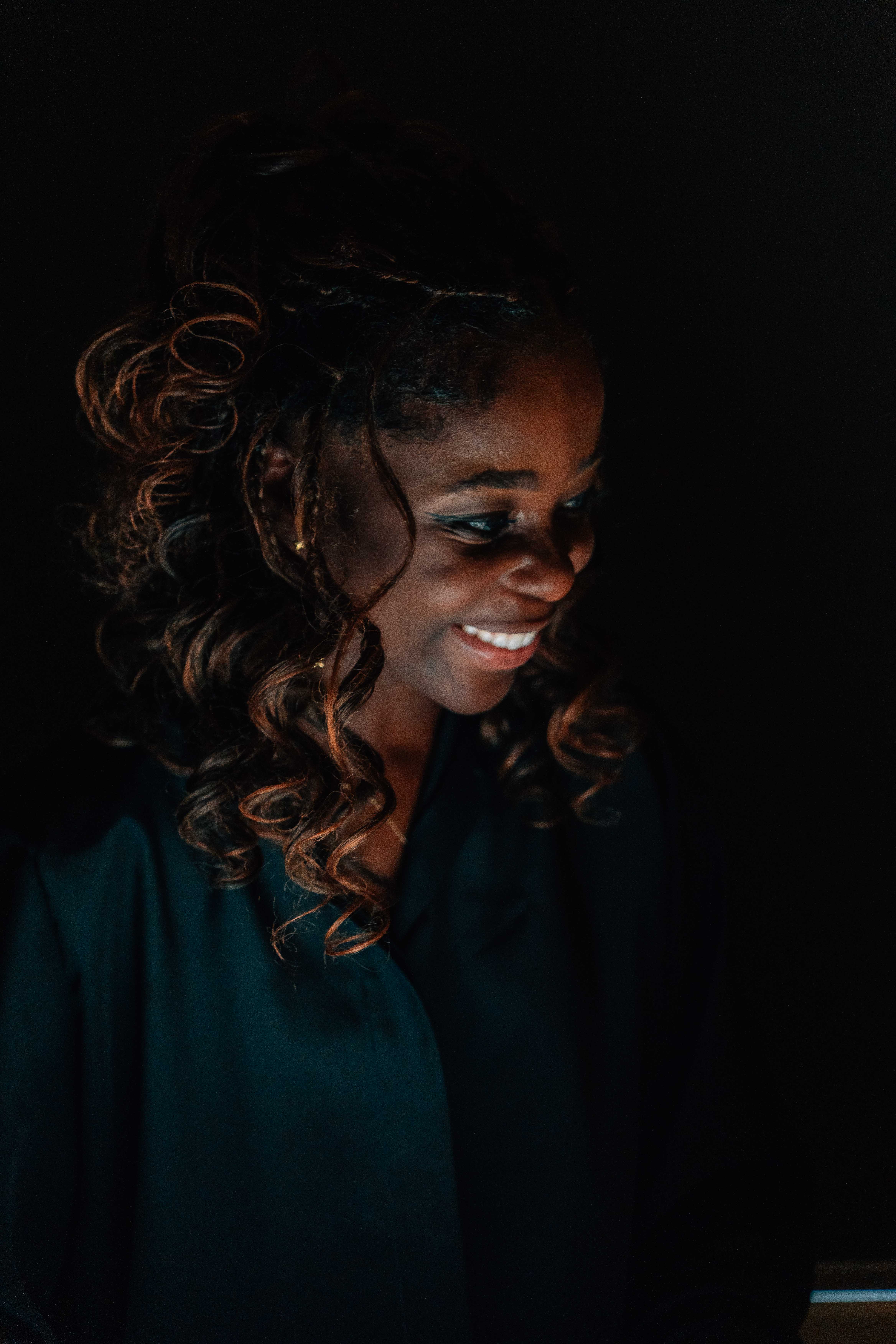 three men and one woman laughing during daytime
