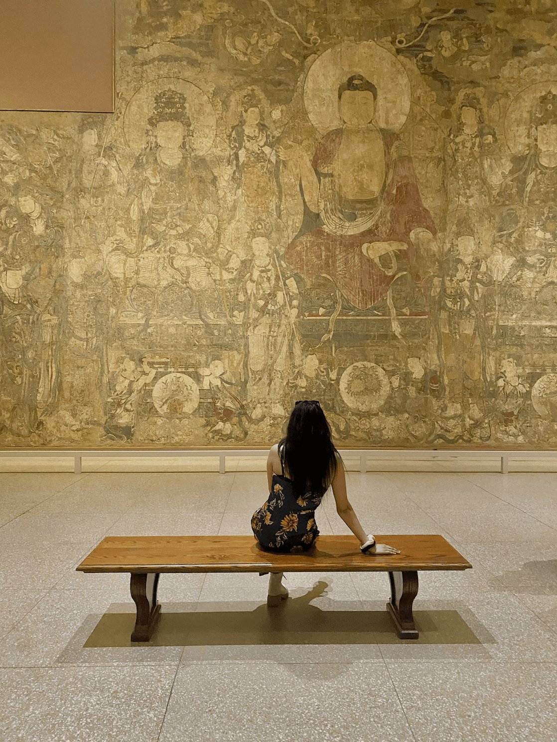 Yellow directional signpost with global destinations and local destinations.