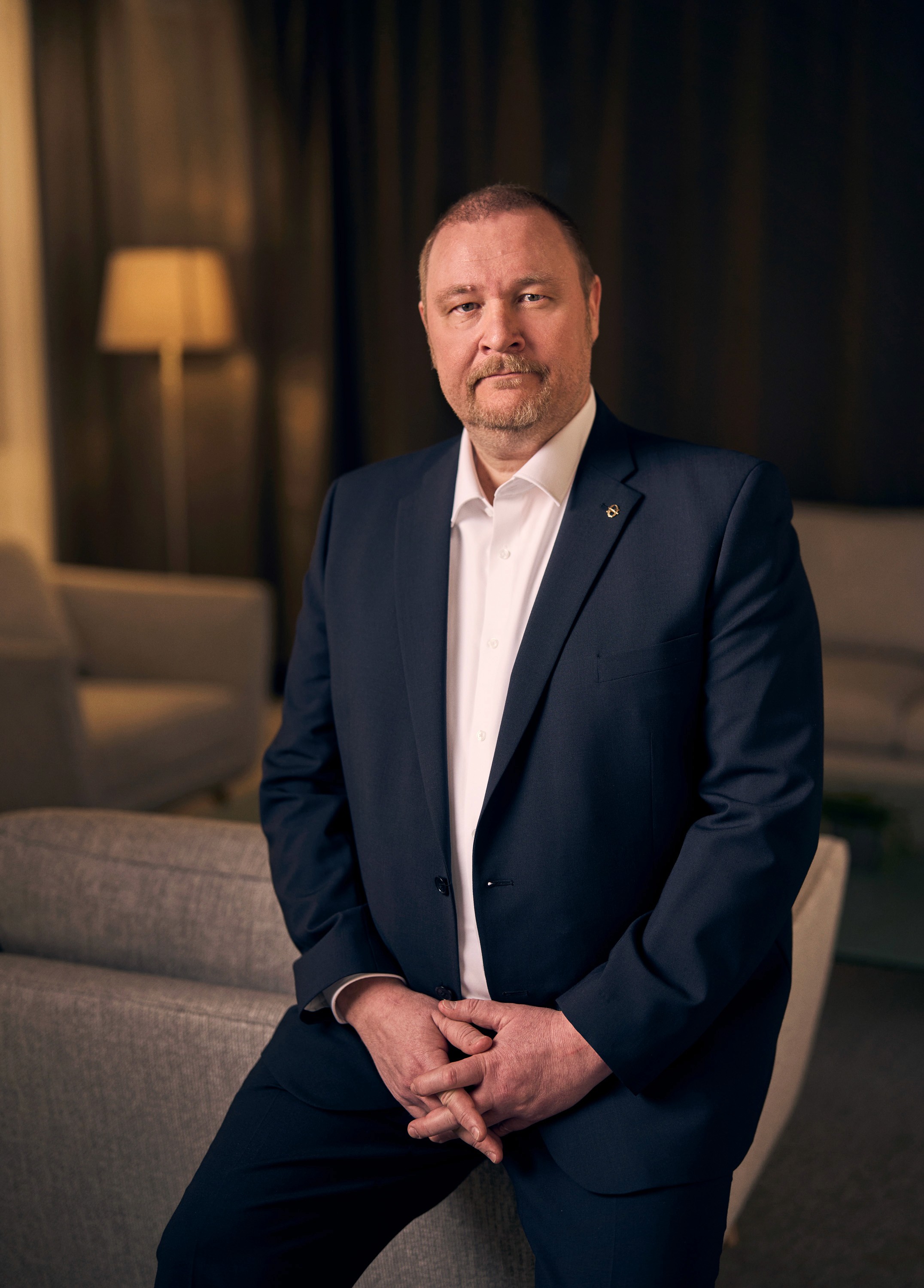 Portrait of John Doe Anderson, CEO of Omnis.