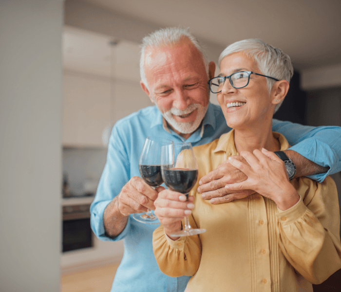 woman in brown coat using macbook air