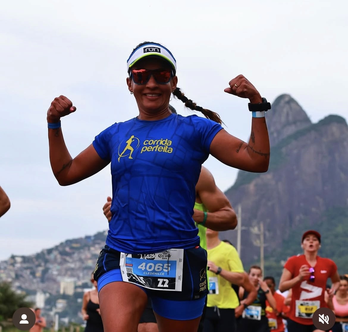 smiling woman wearing white and black pinstriped collared top