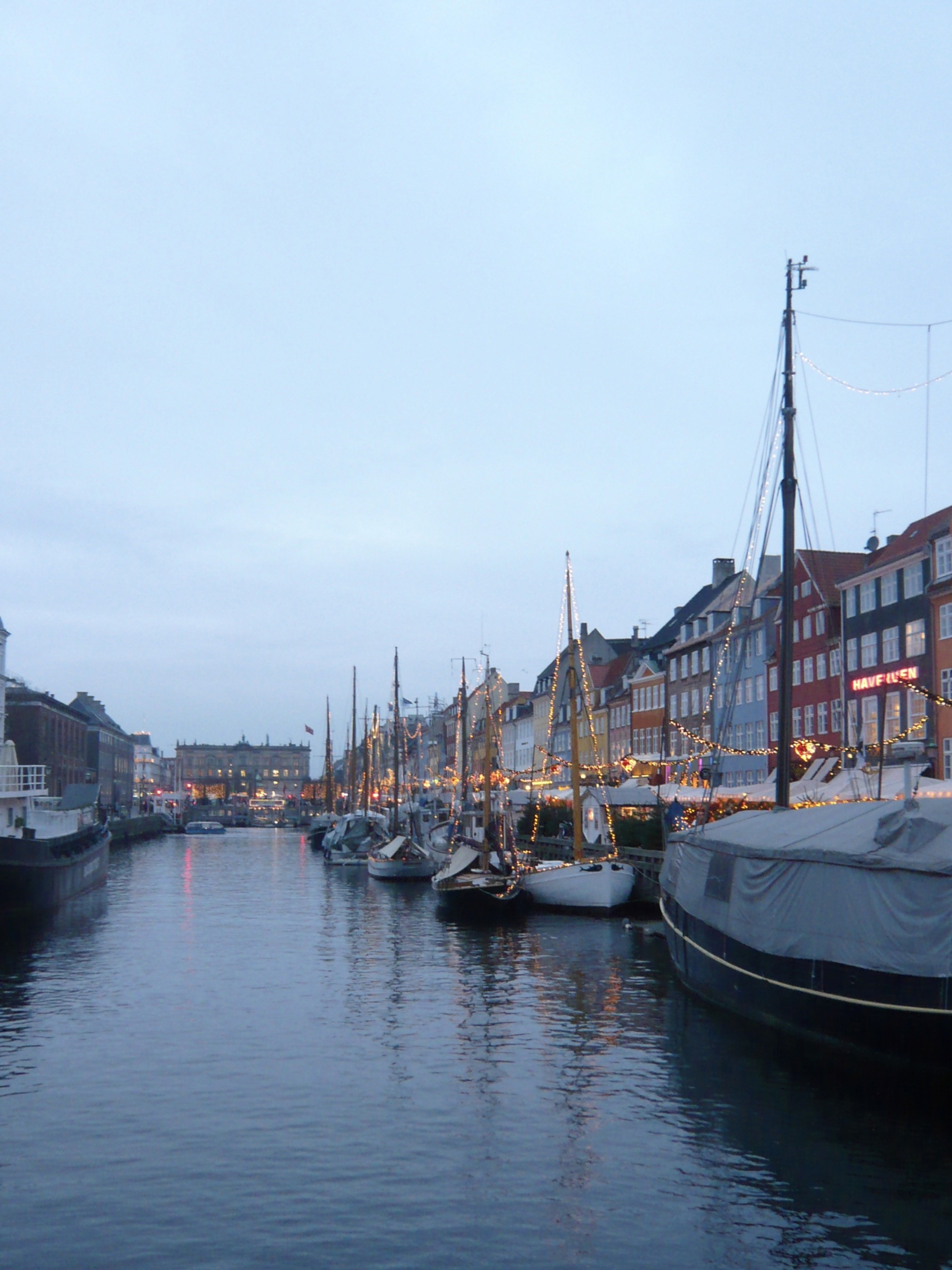 man filming on beach