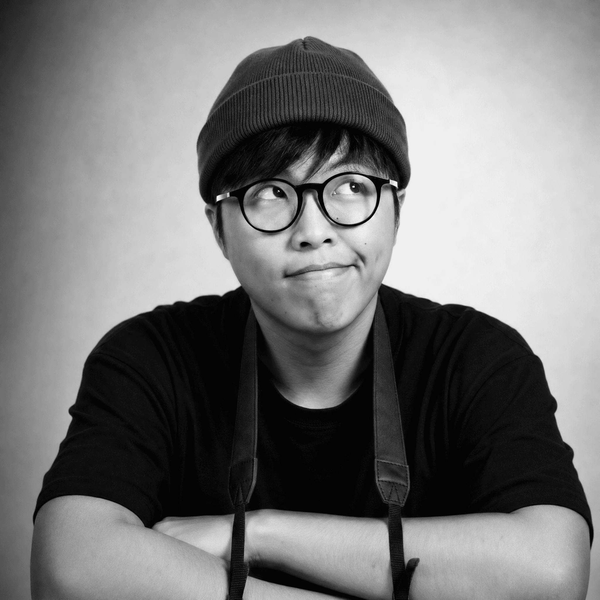 grayscale photo of man in crew neck shirt and eyeglasses