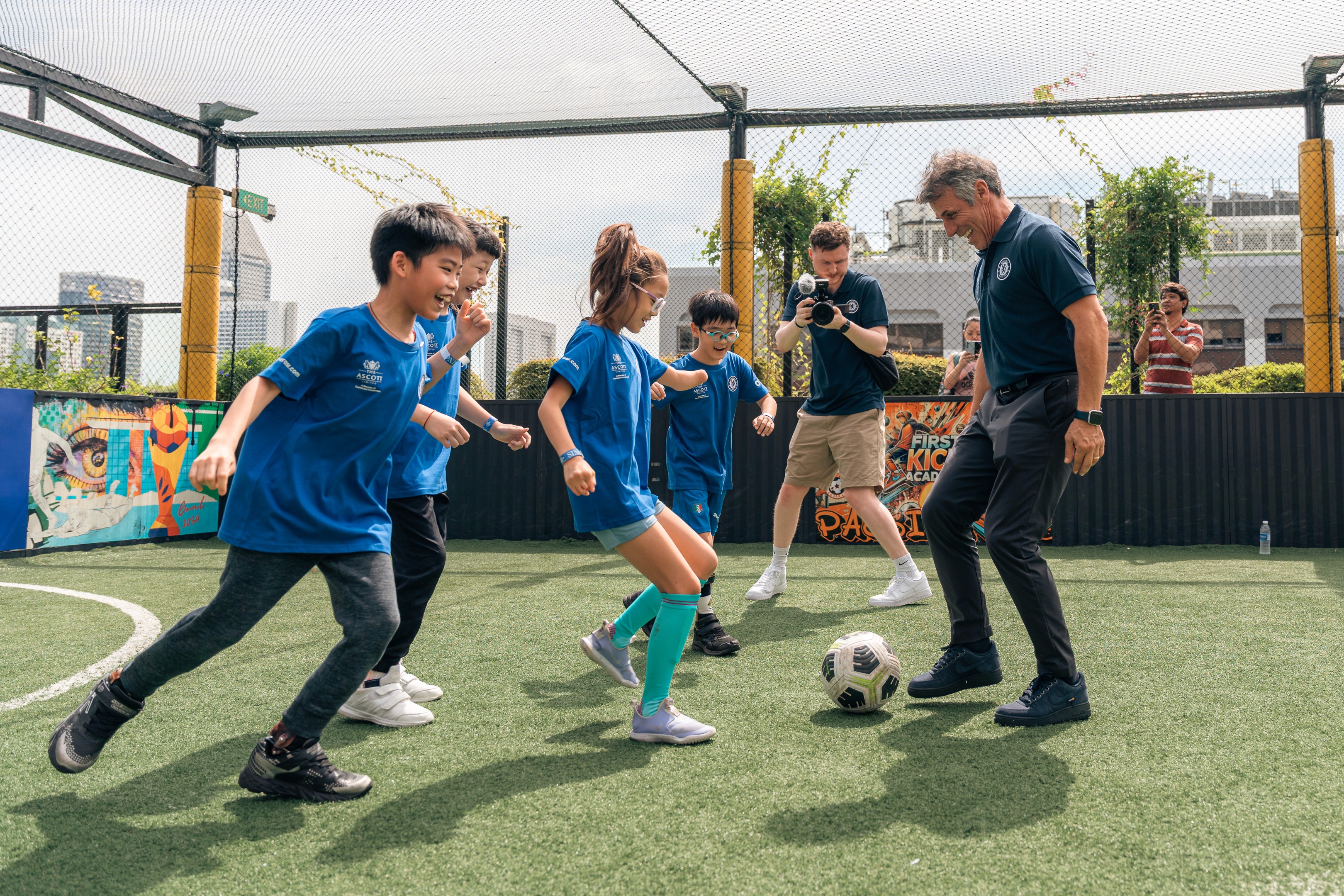 Gianfranco Zola plays football with young Chelsea fans at the Famous CFC in Singapore 2024