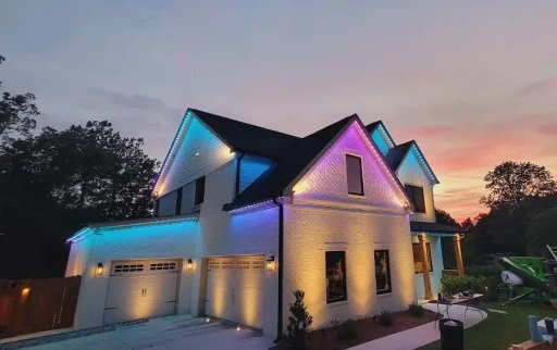 Residential Christmas lighting service with red accents and roofline lights in Chester County, PA, creating a bold holiday display.