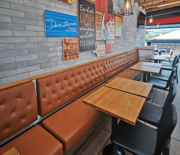 a living room with two recliners and a sink