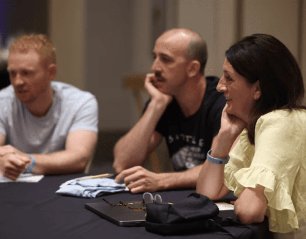 A team of people at a table thinking