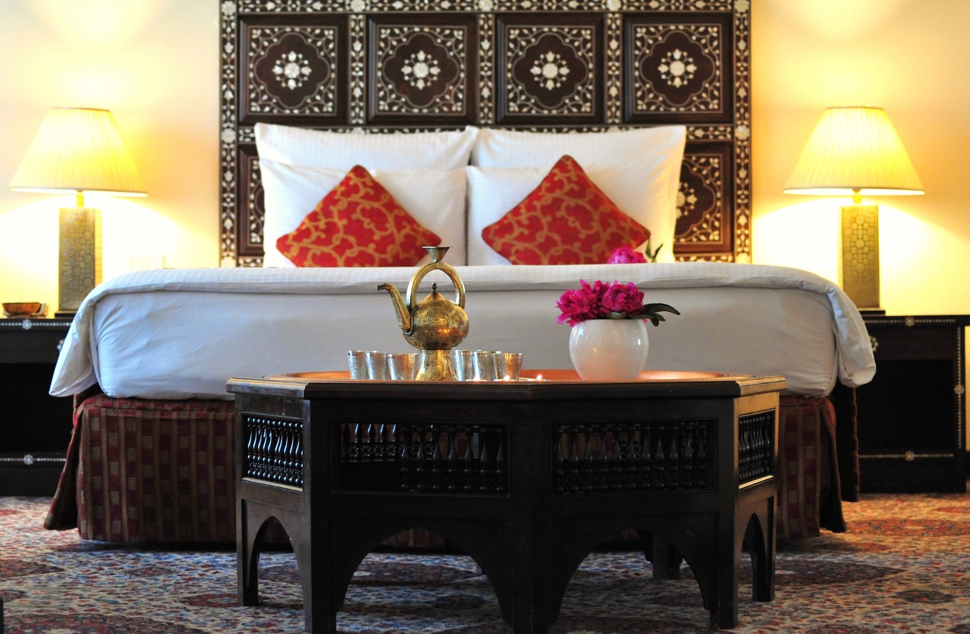 Oriental Suite bed with mother-of-pearl inlaid headboard and brass tea set