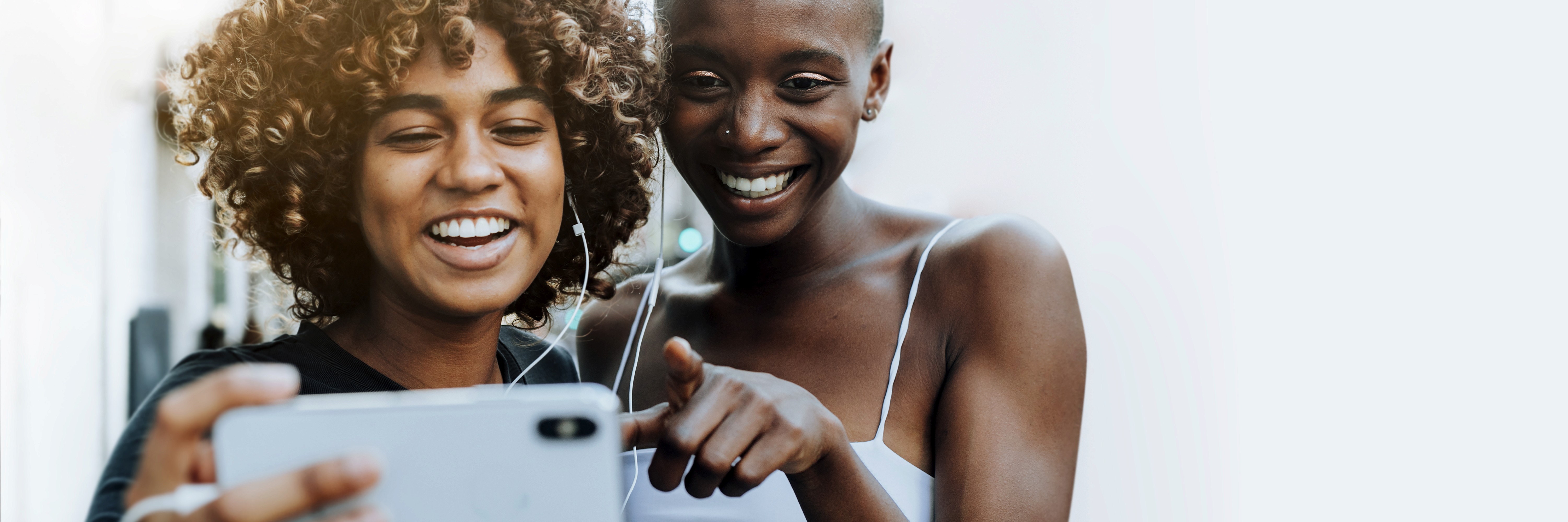 Two ladies looking at a phone