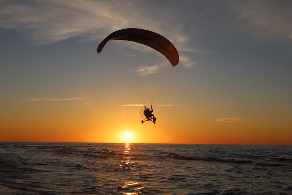 gray concrete dock bridge near seashore