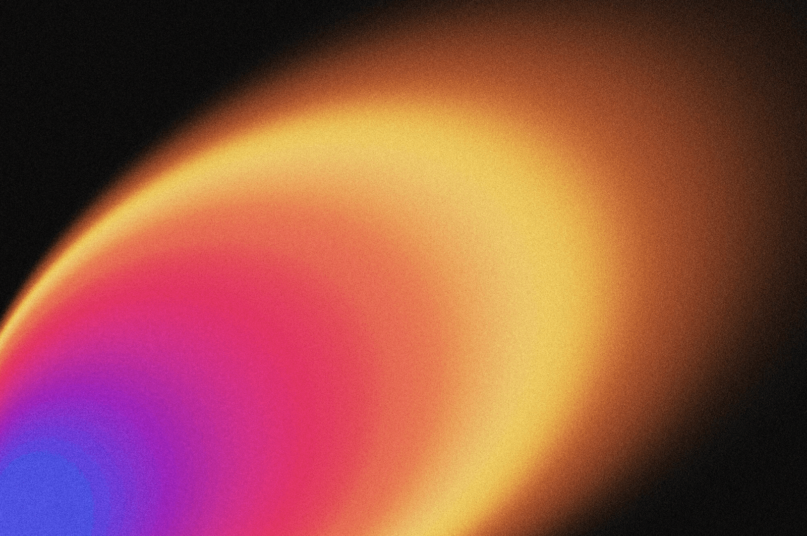 Close-up portrait of a person wearing a gray insulated hooded jacket with the hood up, showing their face framed by the hood against a light background.