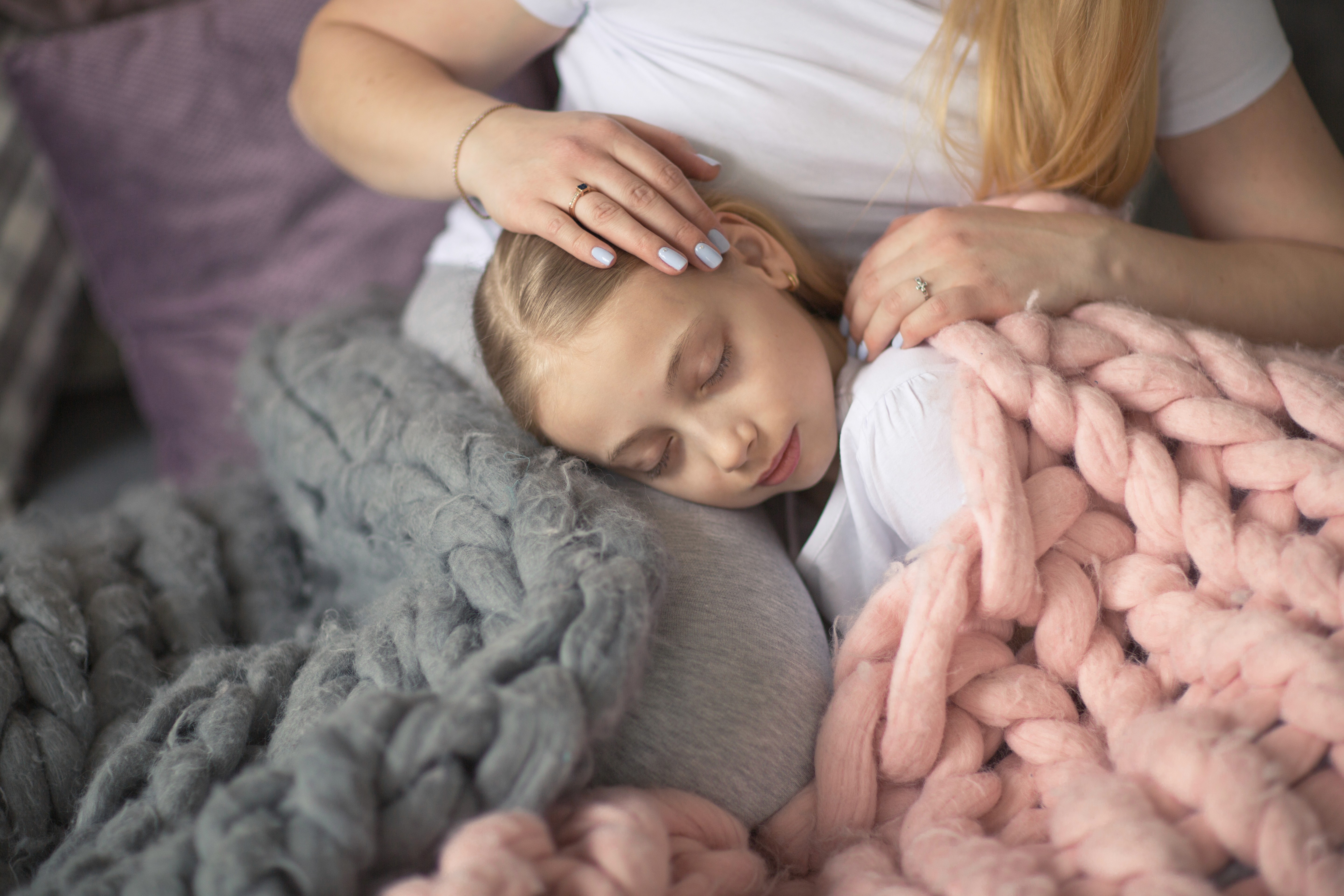 A kid having some good moments with her mom after a play therapy session in Dallas, Texas.